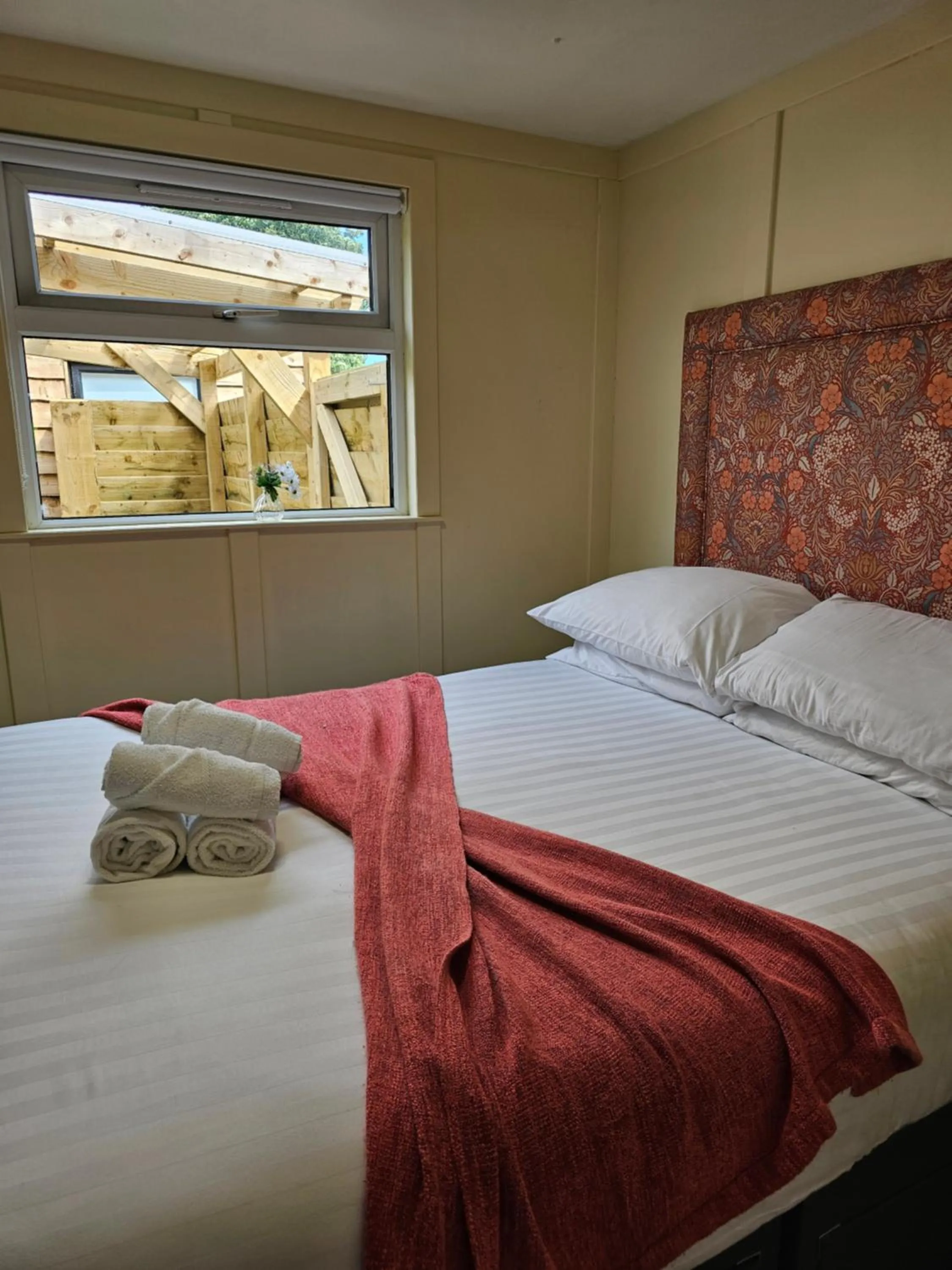 Bed in Walsh's Mill Lodges & Linen House