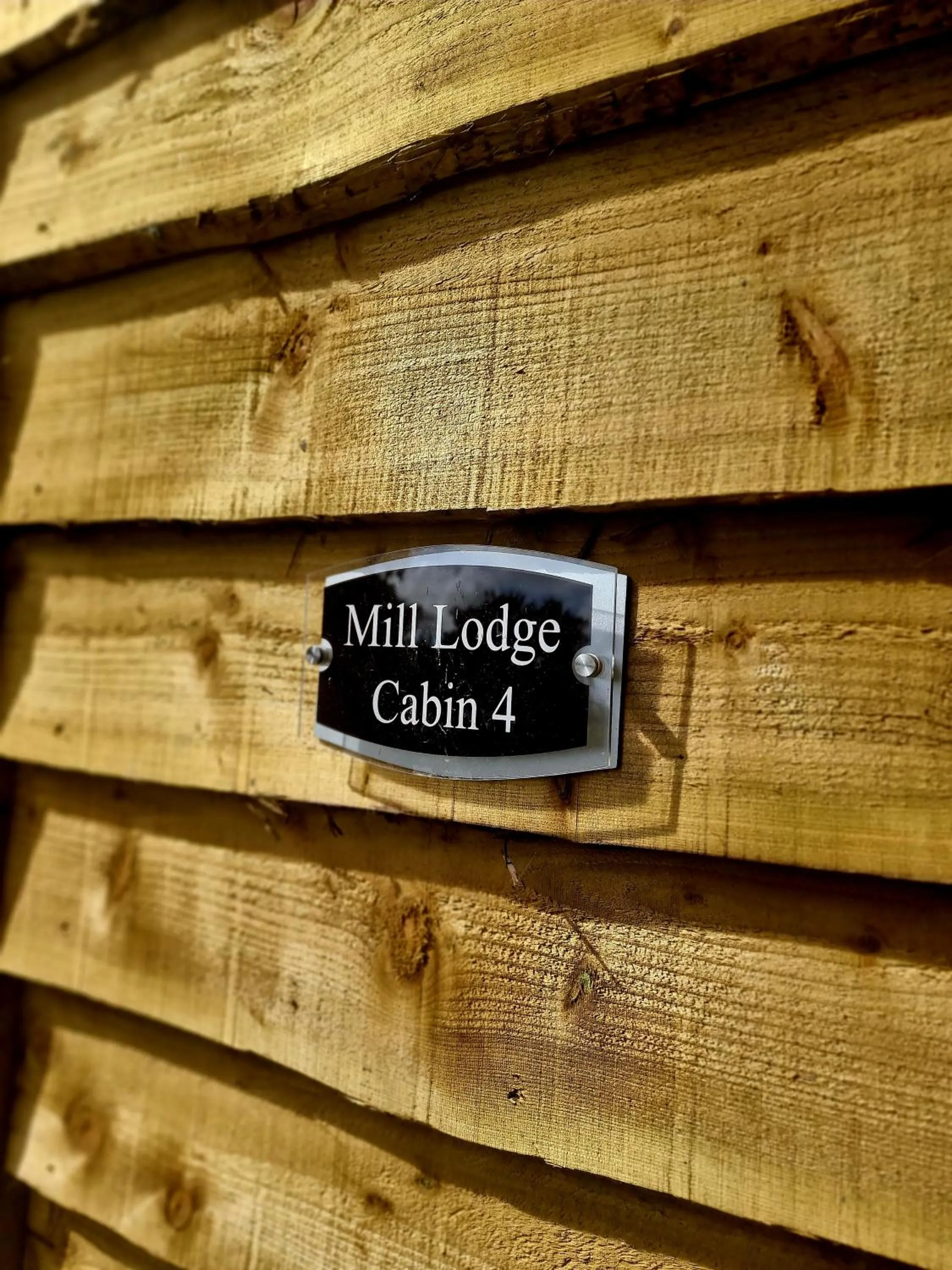 Property logo or sign in Walsh's Mill Lodges & Linen House