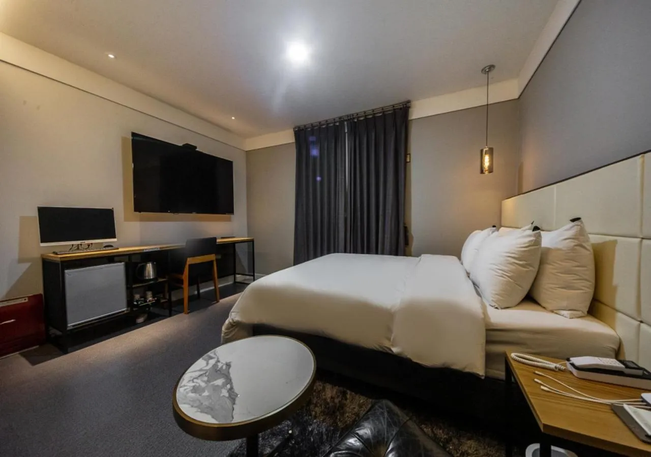 Photo of the whole room, Bed in West In Hotel Yeosu