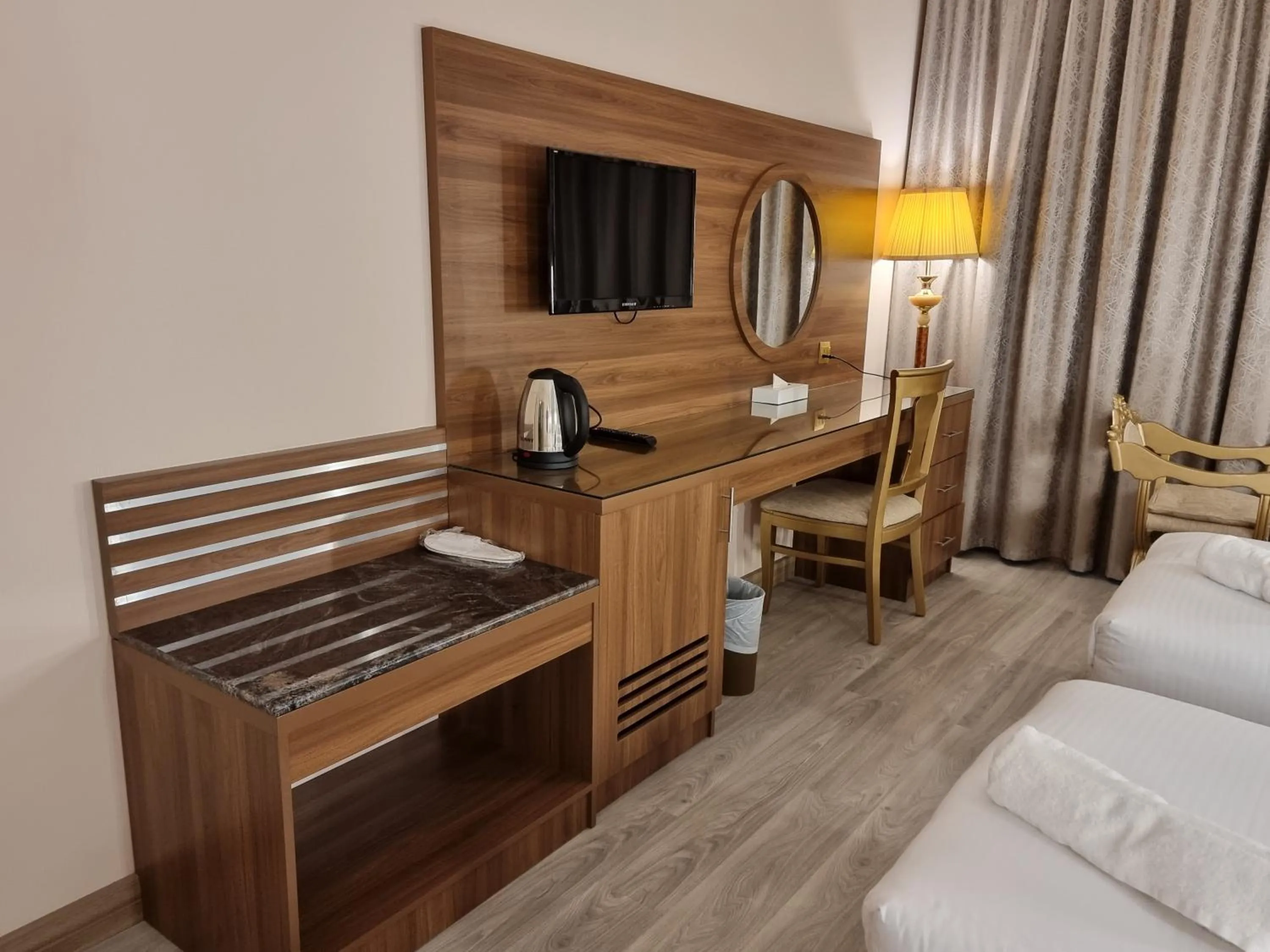 Living room, Bed in Bliss Square Hotel