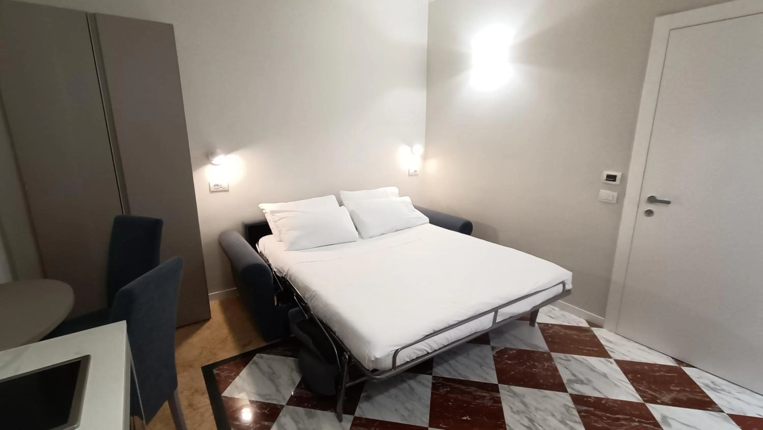 Bed in Andreola Central Hotel