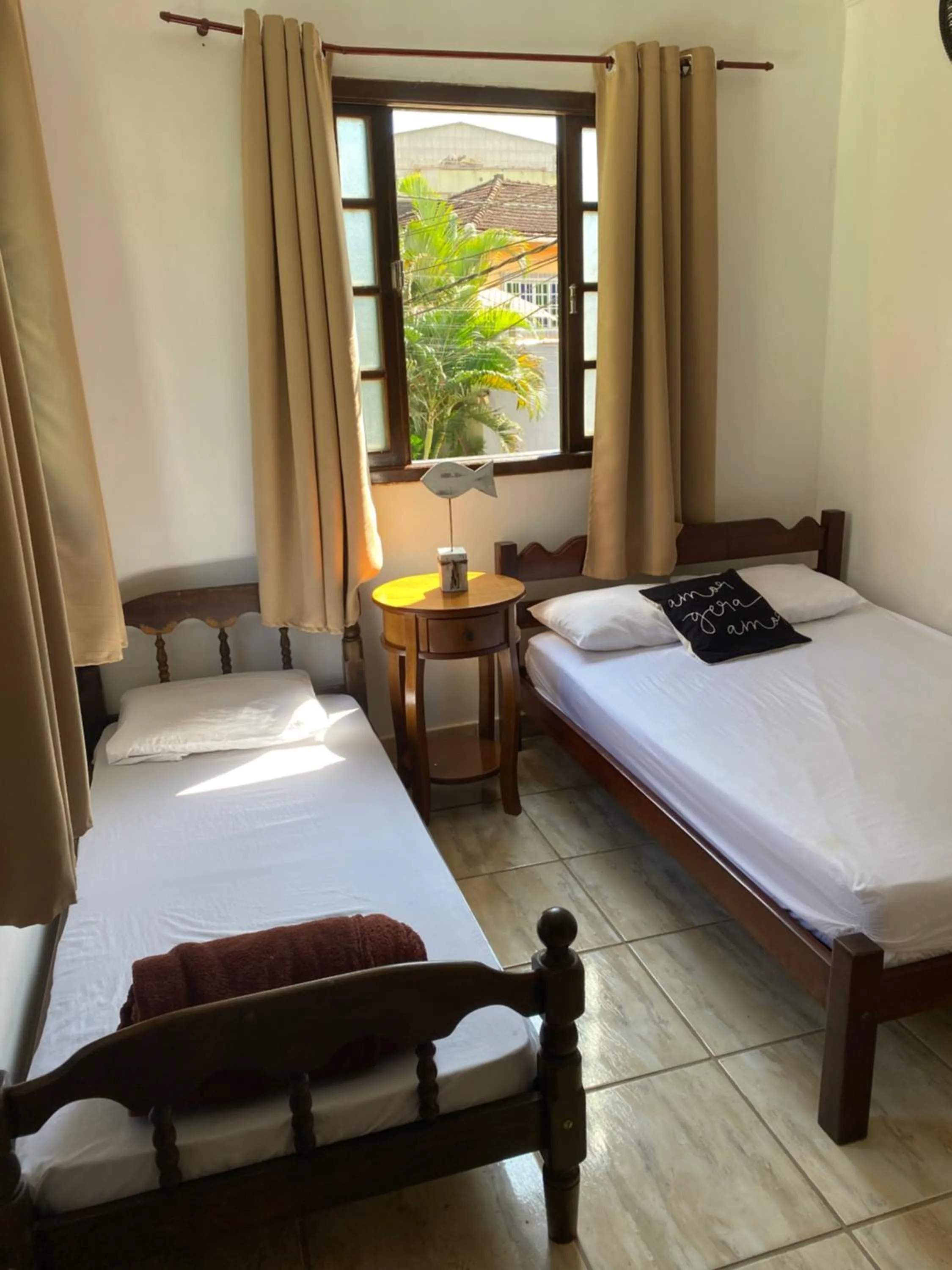 Bed in Pousada Casa de mãe aconchegante com piscina próximo à praia