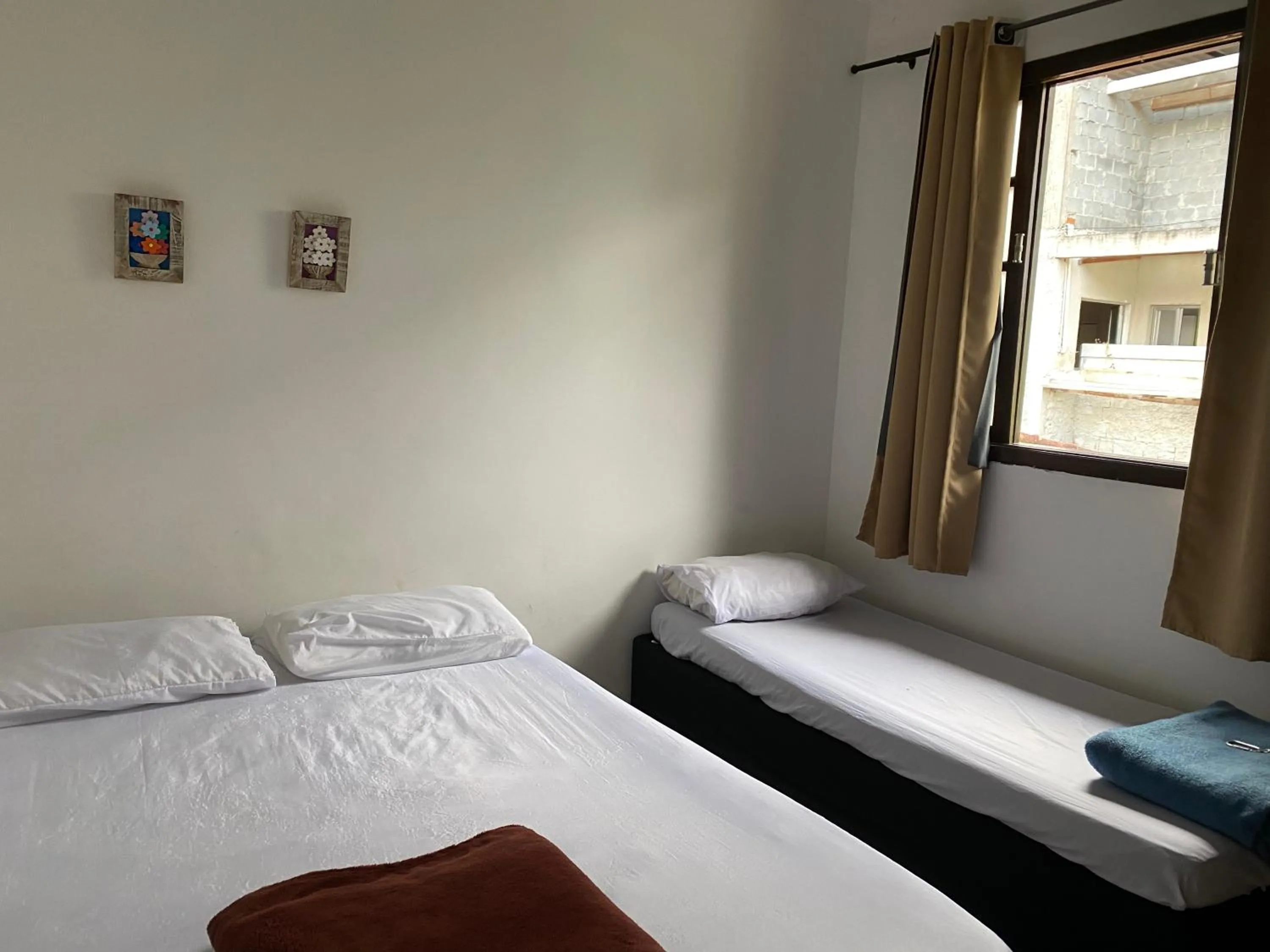 Bed in Pousada Casa de mãe aconchegante com piscina próximo à praia