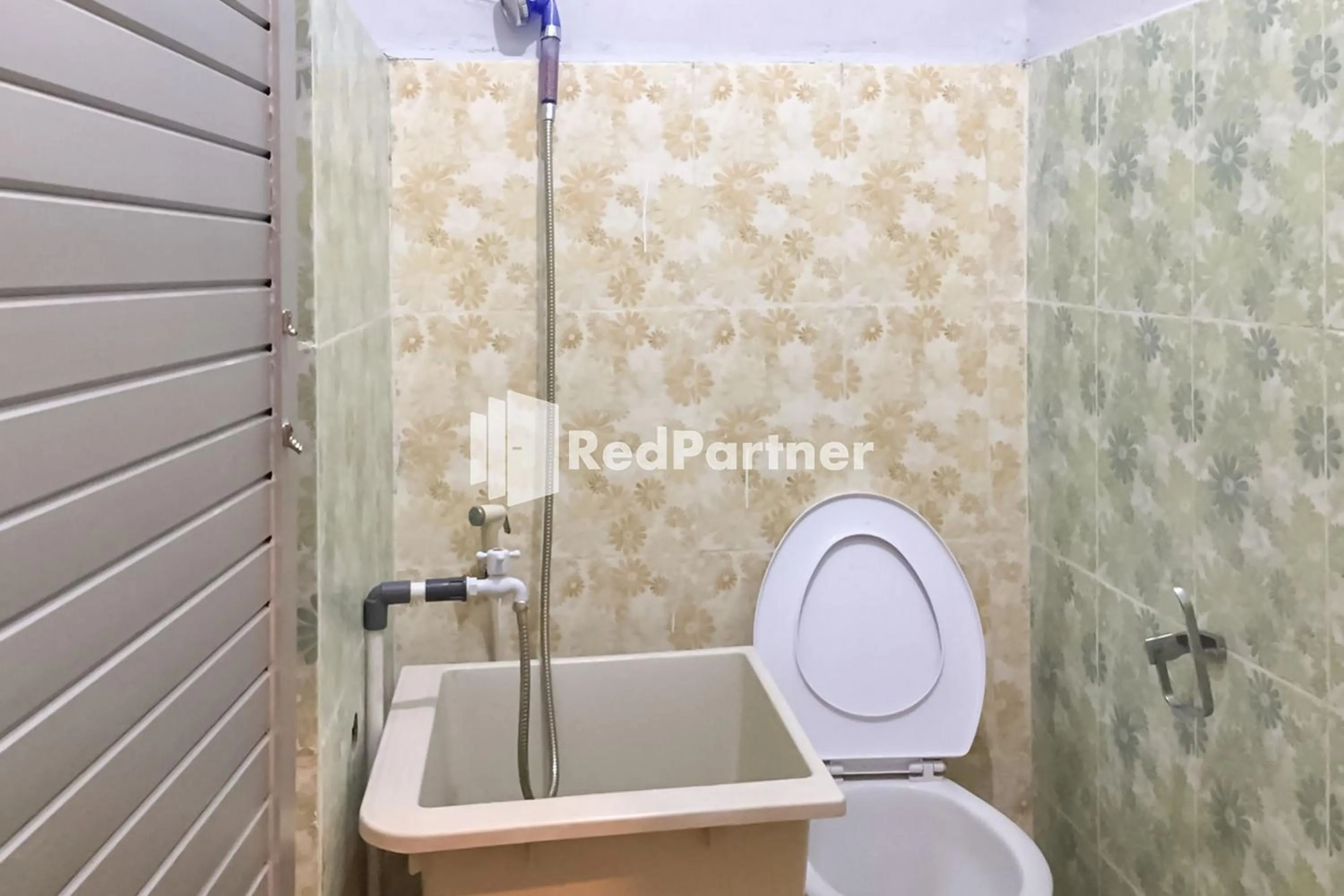 Bathroom in Aquino Marito Homestay Mitra RedDoorz