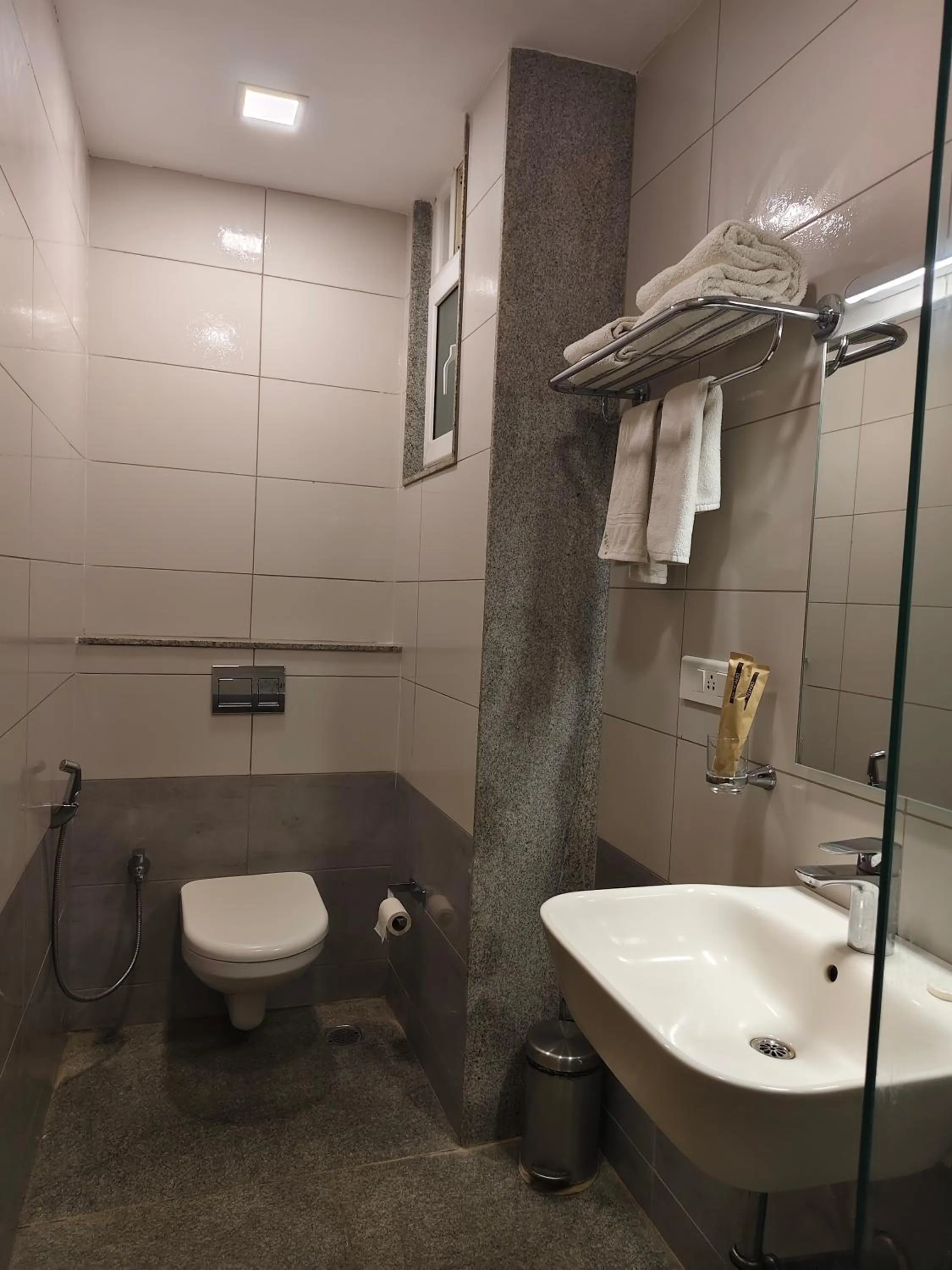 Bathroom in Hotel Aura by Woco Stays