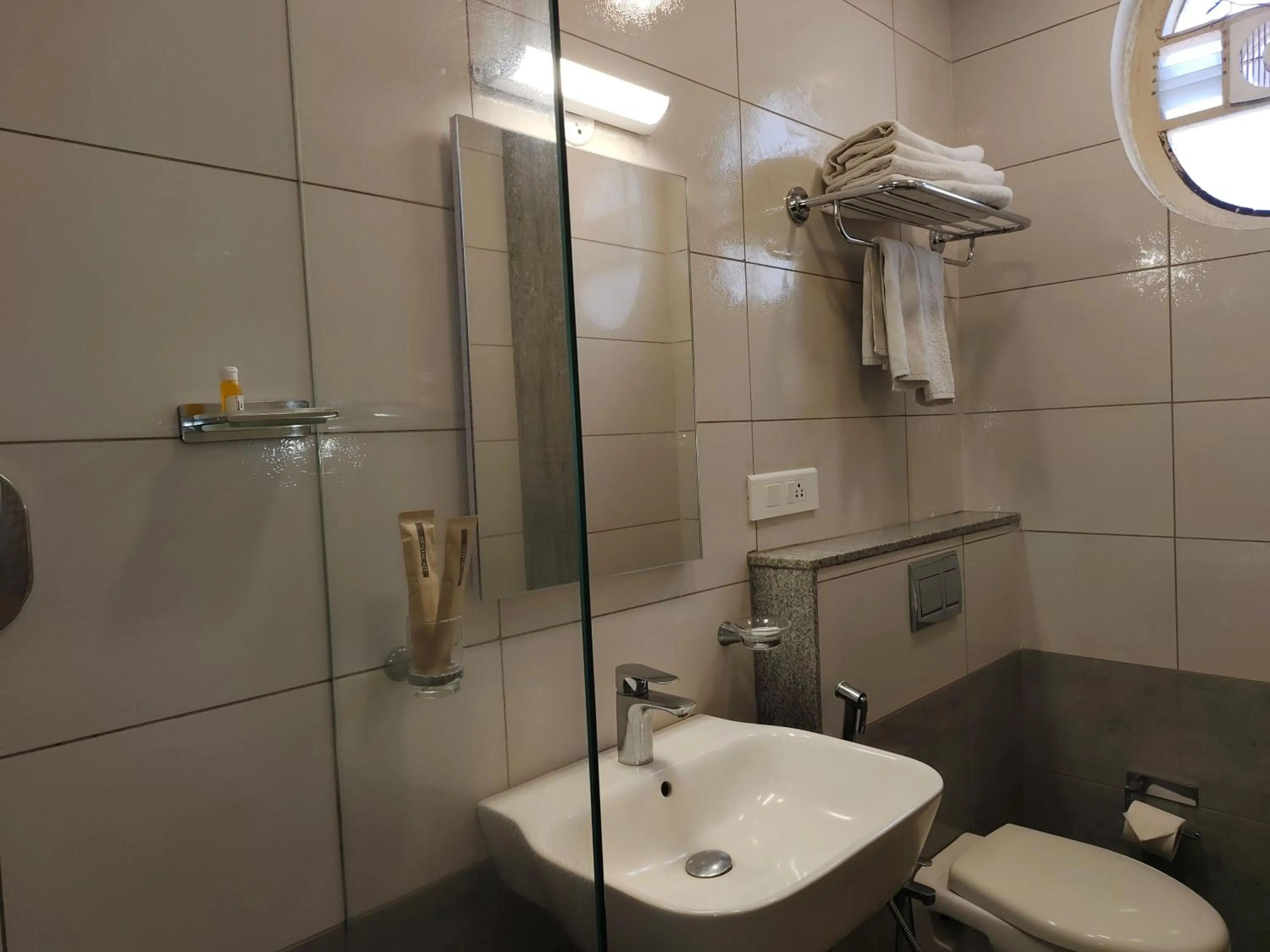 Toilet in Hotel Aura by Woco Stays