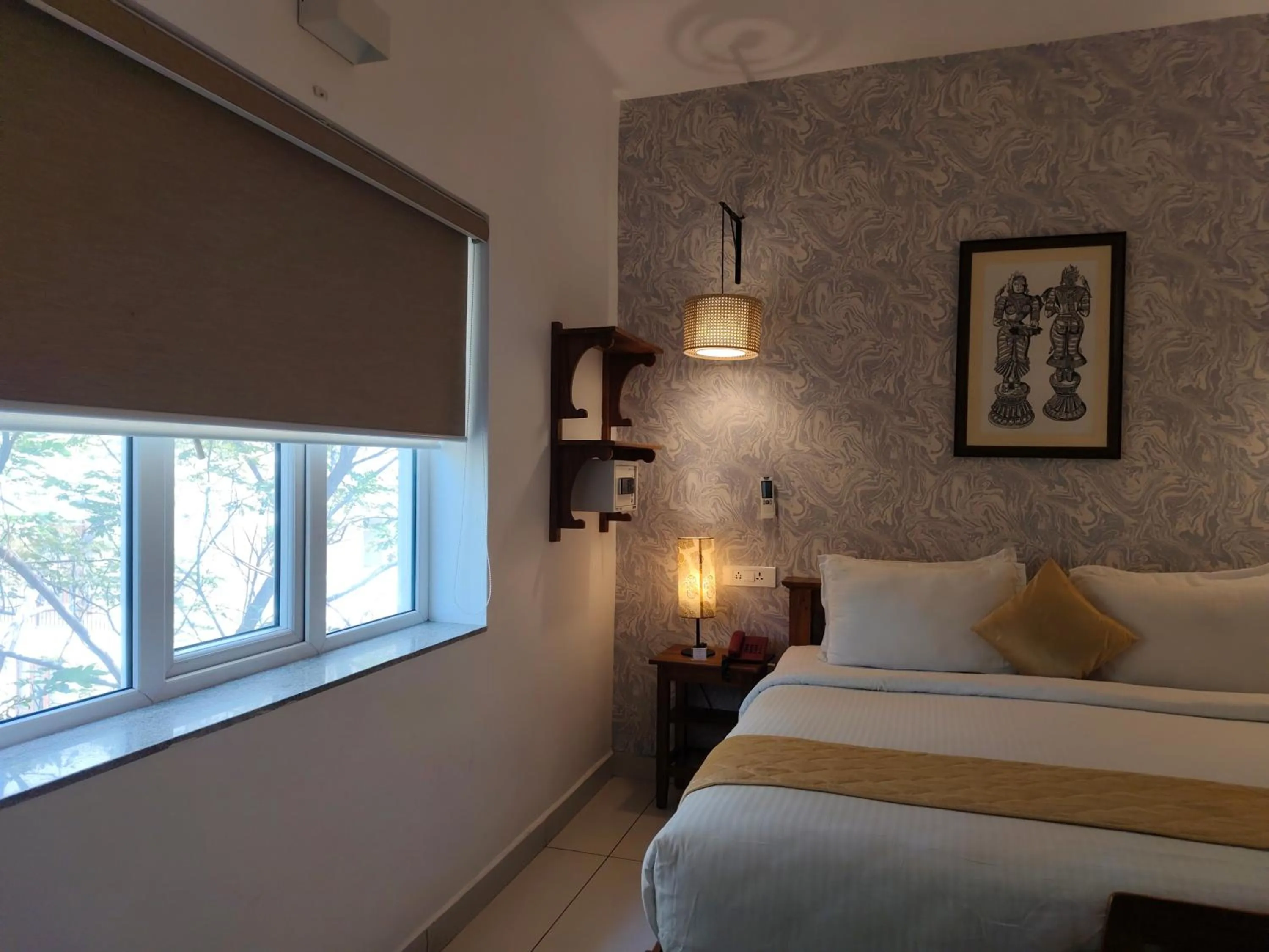 Bed in Hotel Aura by Woco Stays