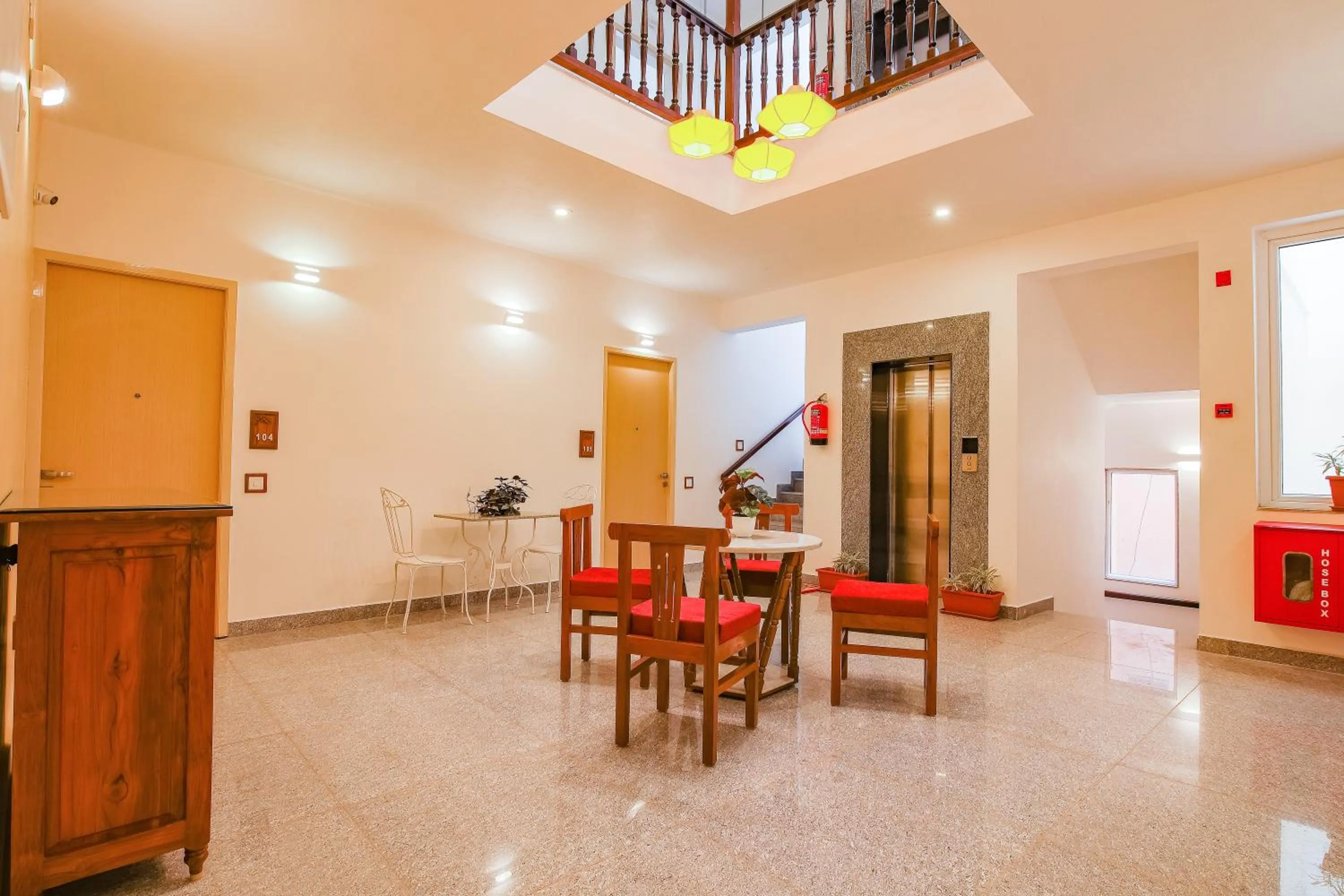 Seating area in Hotel Aura by Woco Stays