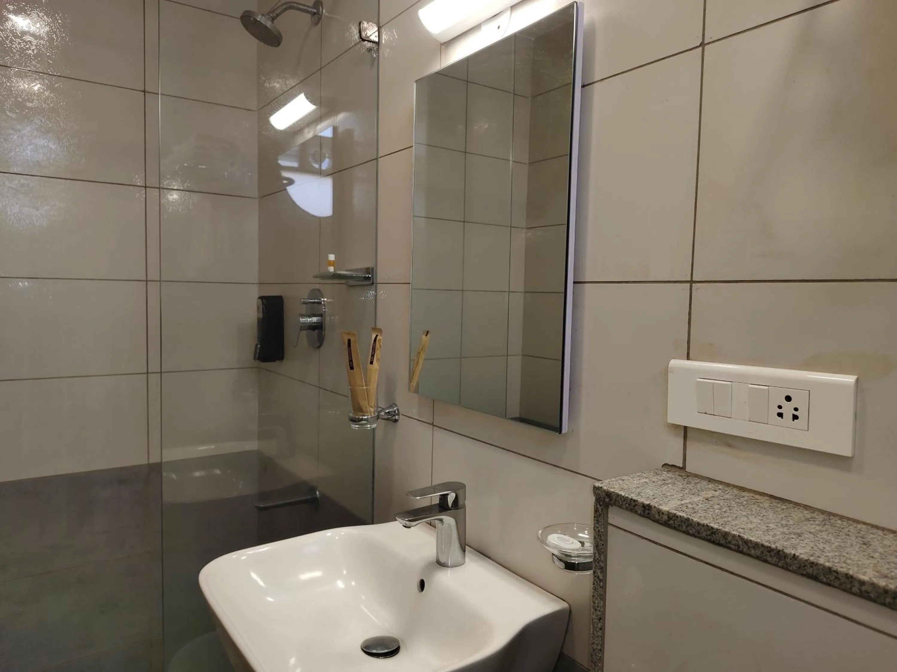 Bathroom in Hotel Aura by Woco Stays