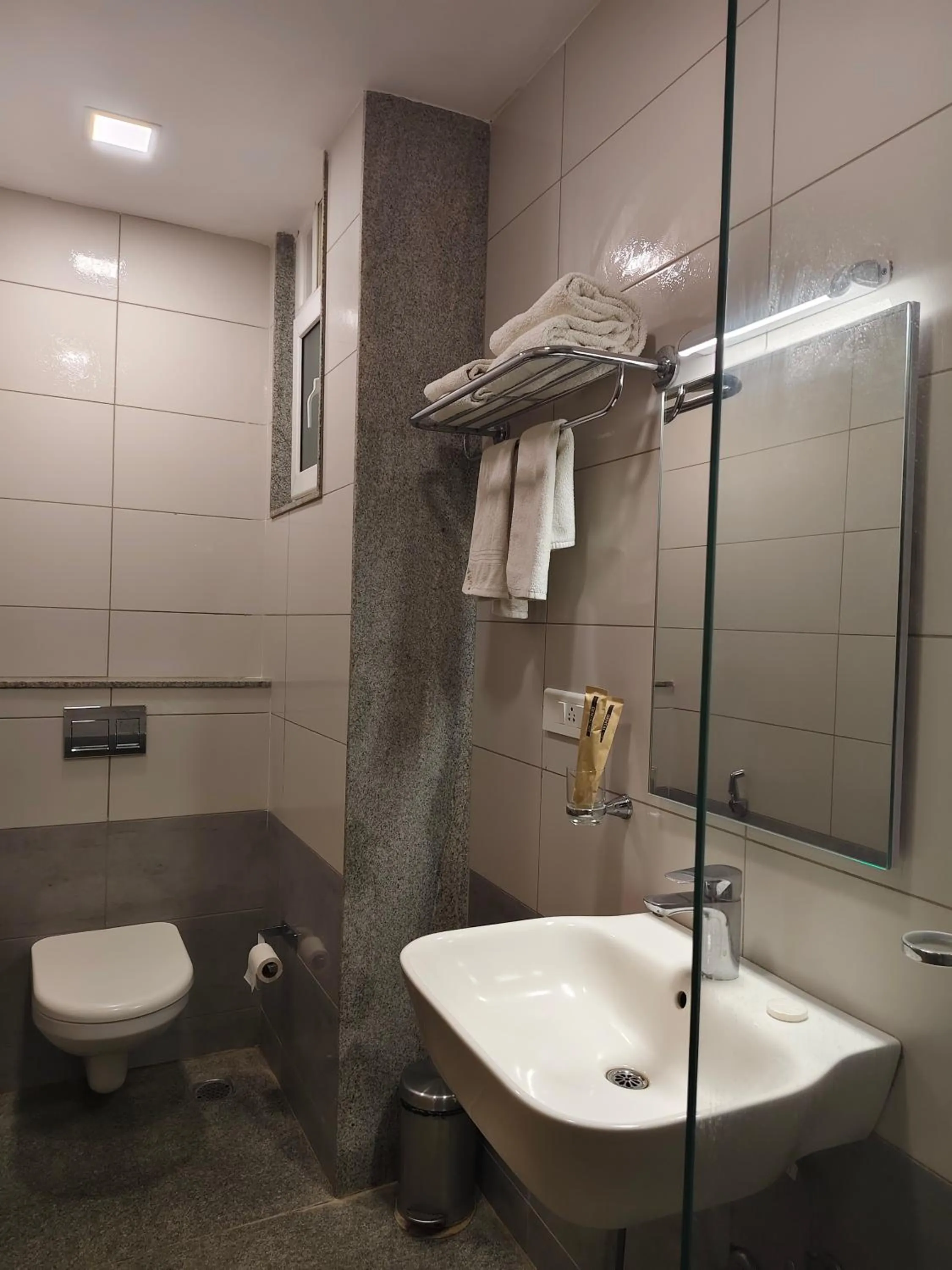 Bathroom in Hotel Aura by Woco Stays
