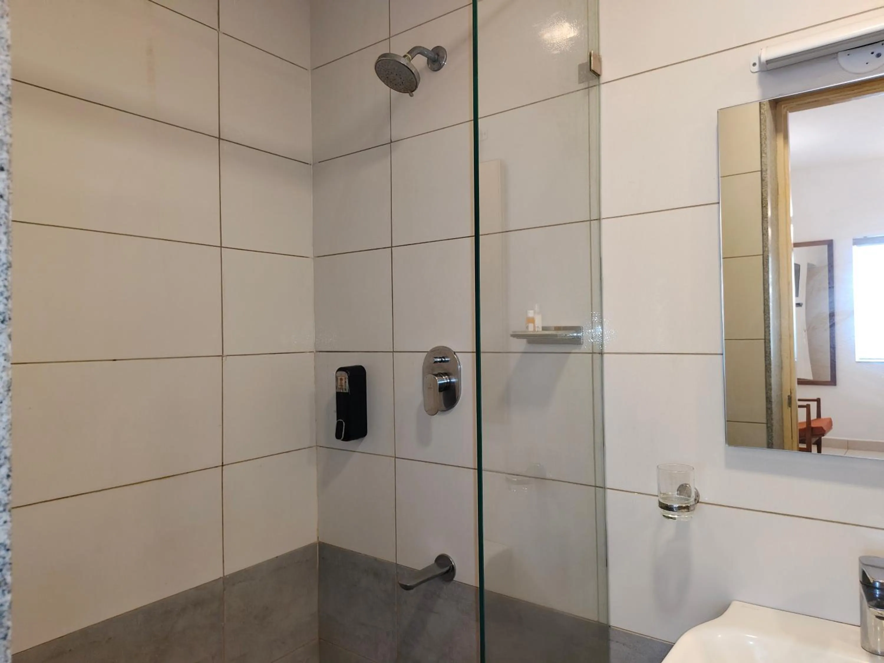 Shower in Hotel Aura by Woco Stays