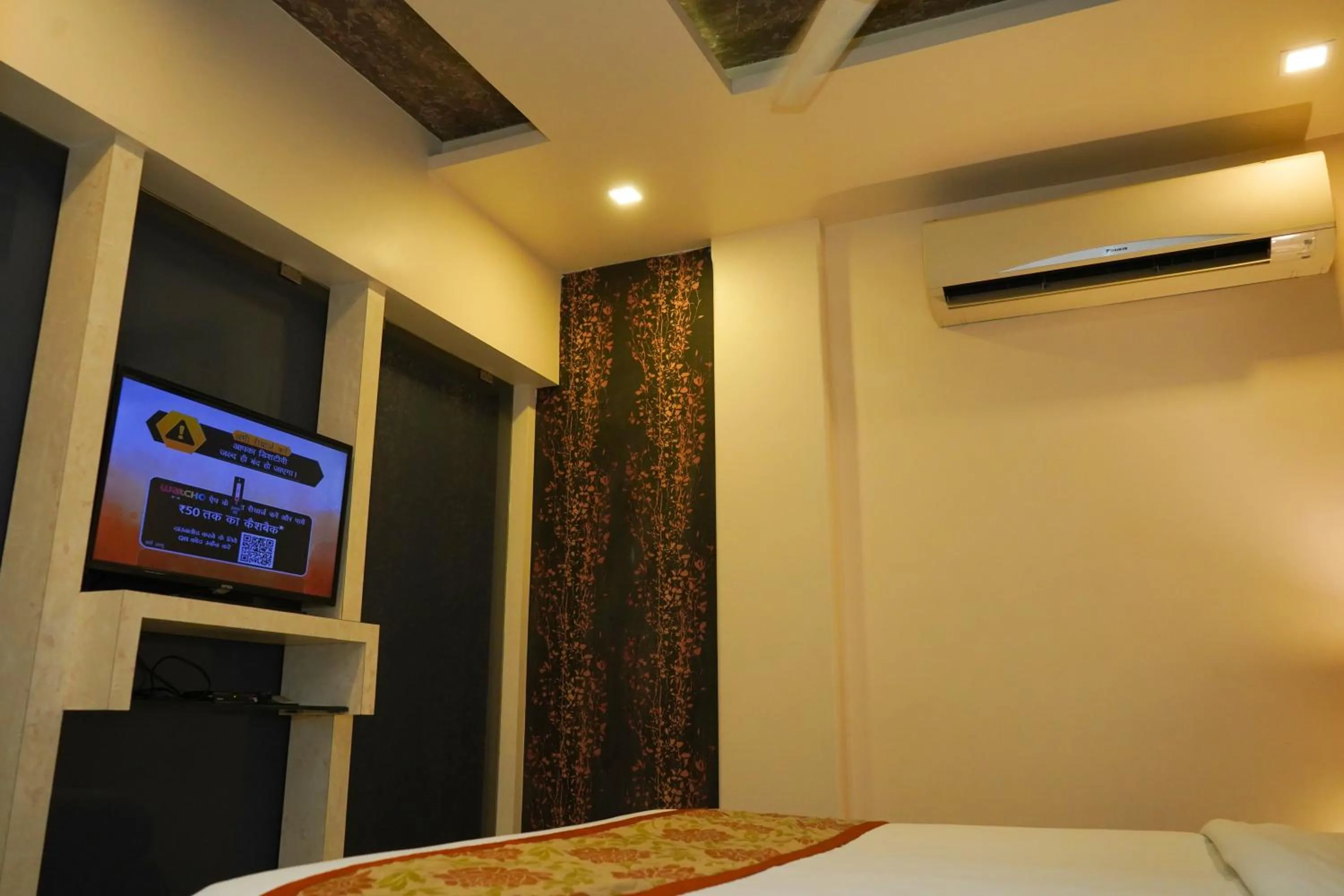 TV and multimedia, Bed in Hotel Spices Navi Mumbai