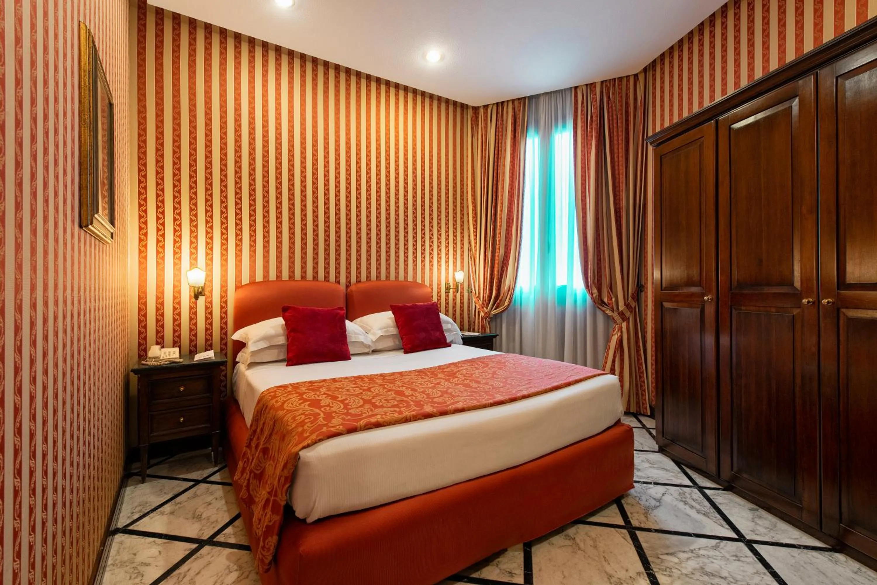 Bed in Atlante Star Hotel