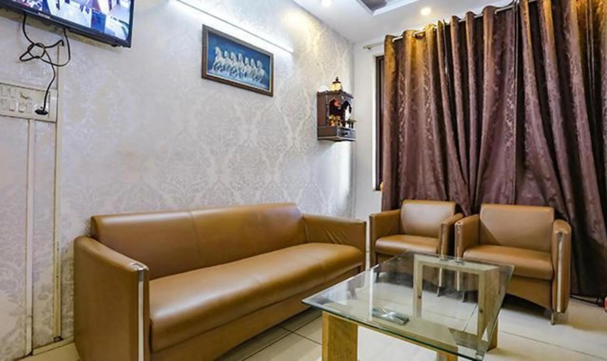 Seating area in FabHotel Comfirt Inn