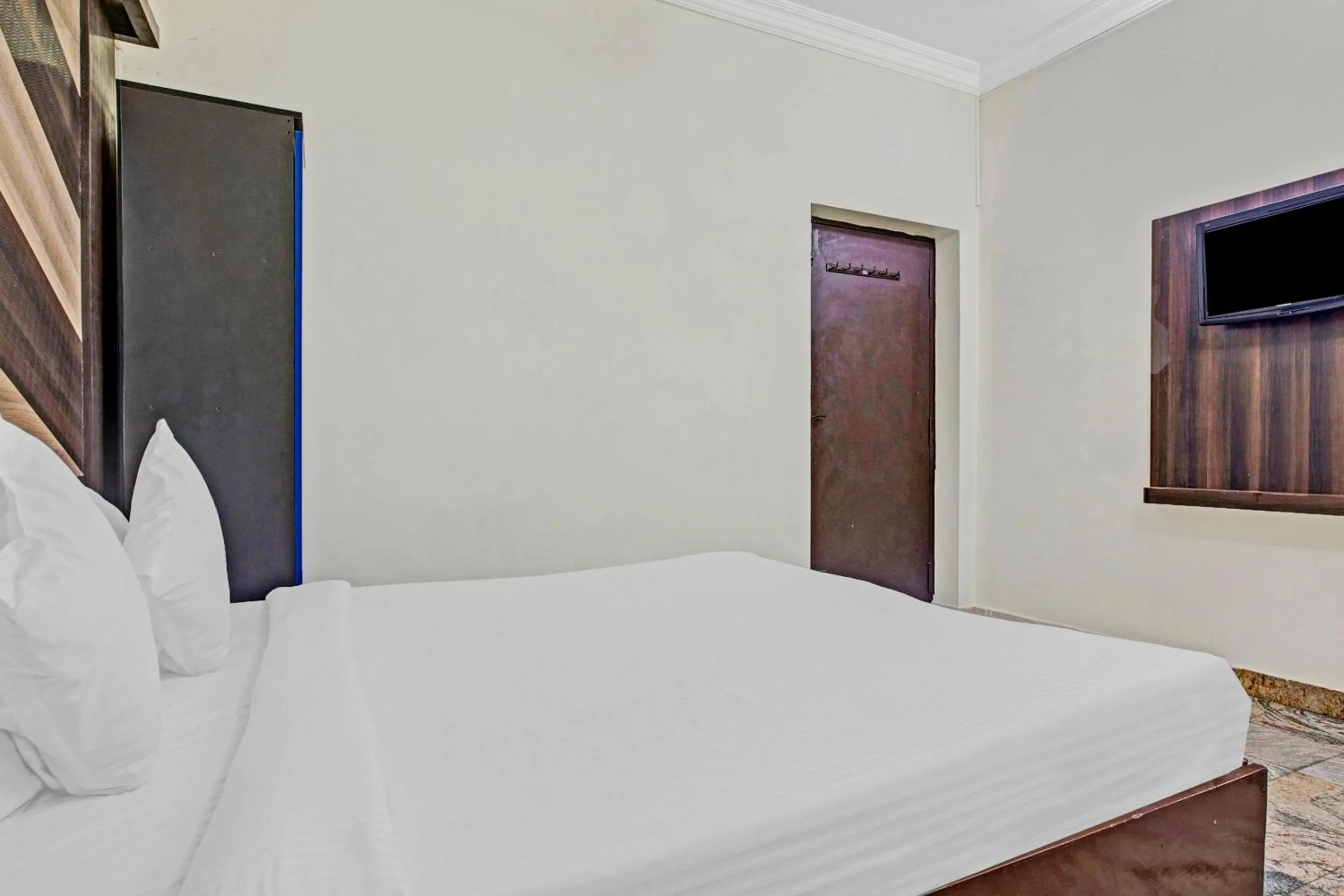 Bedroom in Hotel O Neethu Residency