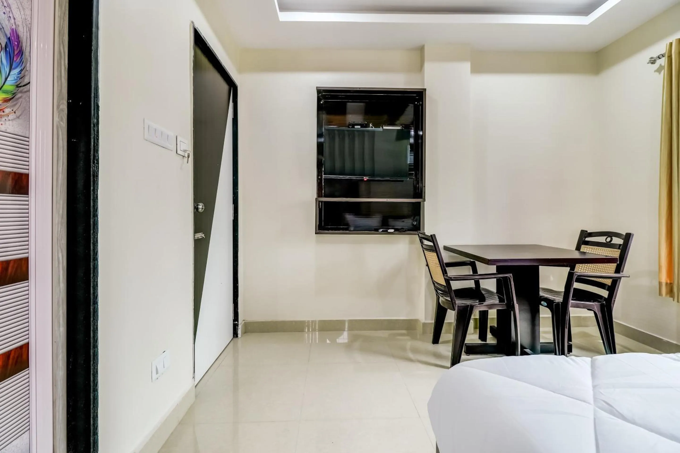 Bedroom in Hotel O Sri Singampalli Residency