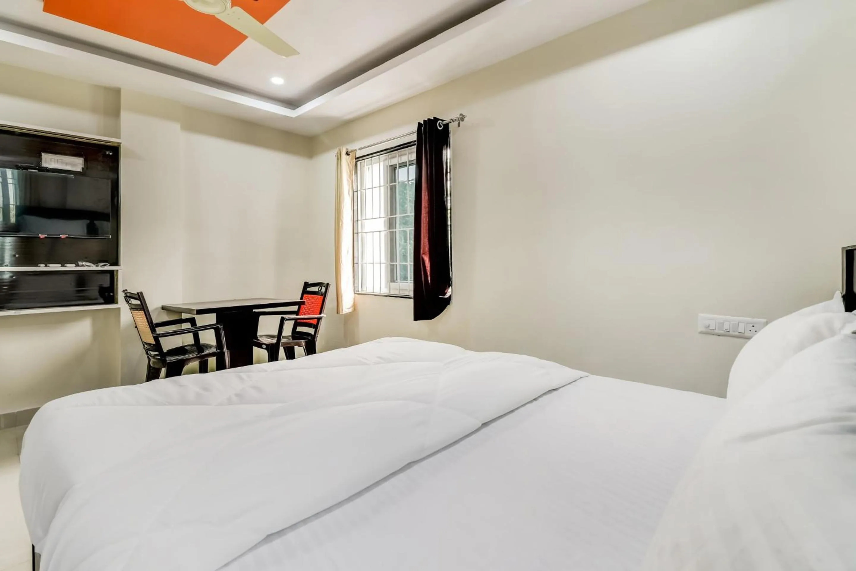 Bedroom in Hotel O Sri Singampalli Residency