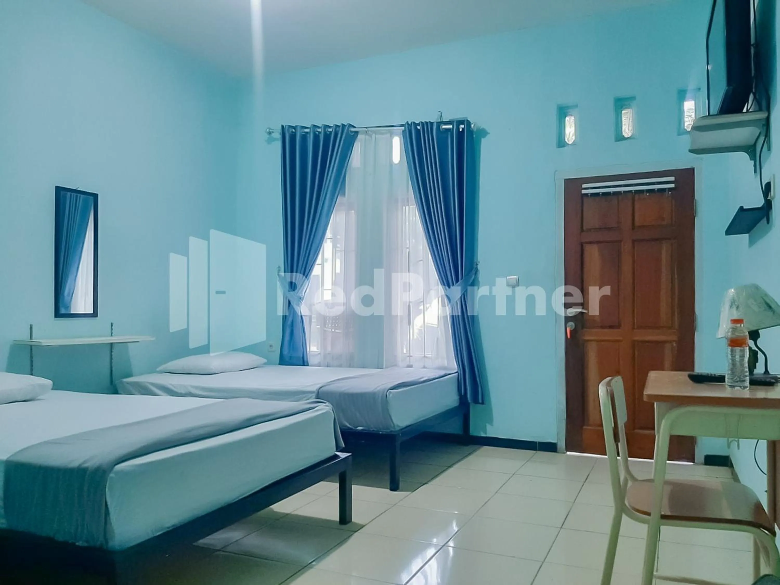 Bed in Syariah Safar Guest House Mitra RedDoorz