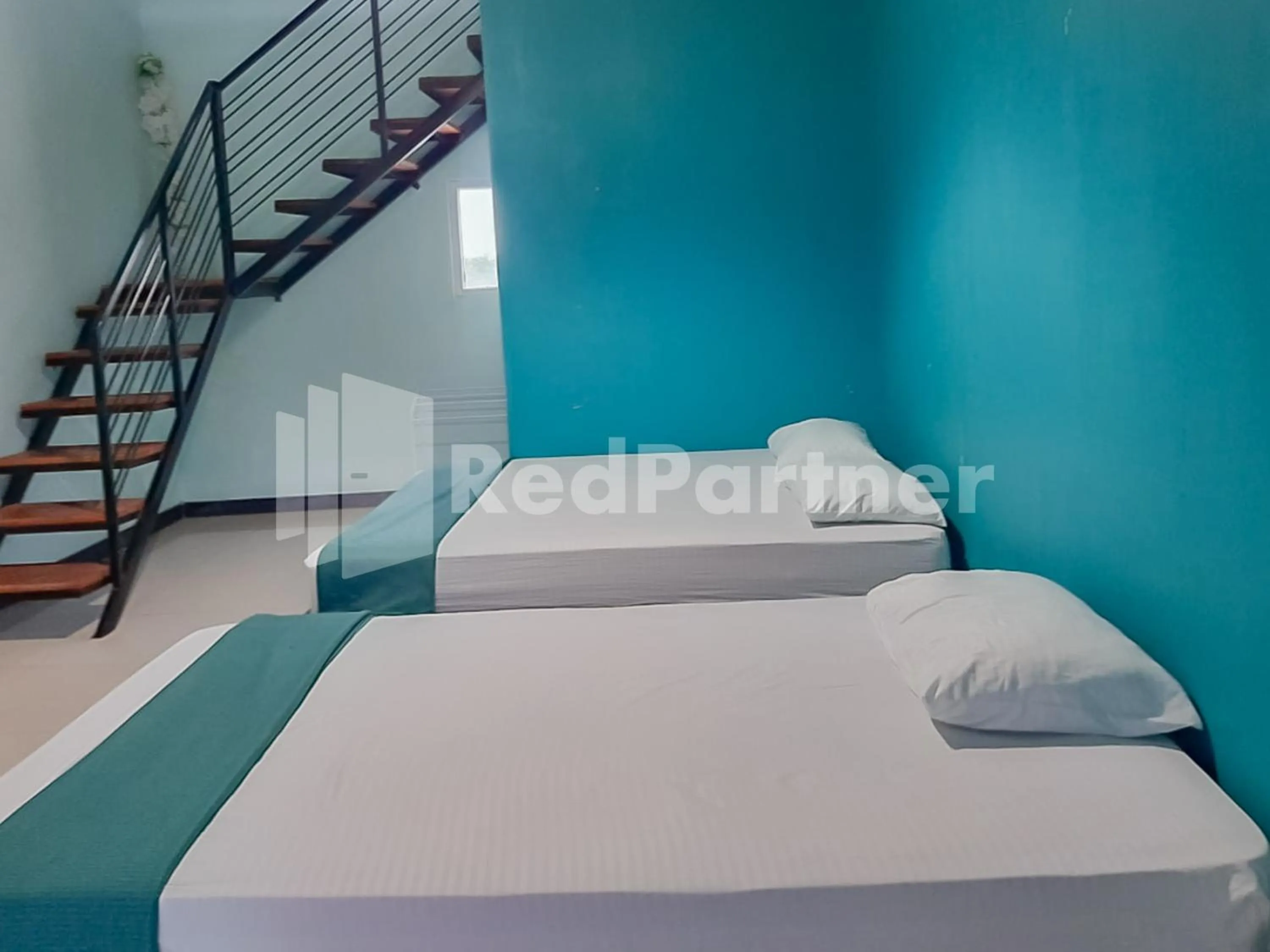 Bed in Syariah Safar Guest House Mitra RedDoorz