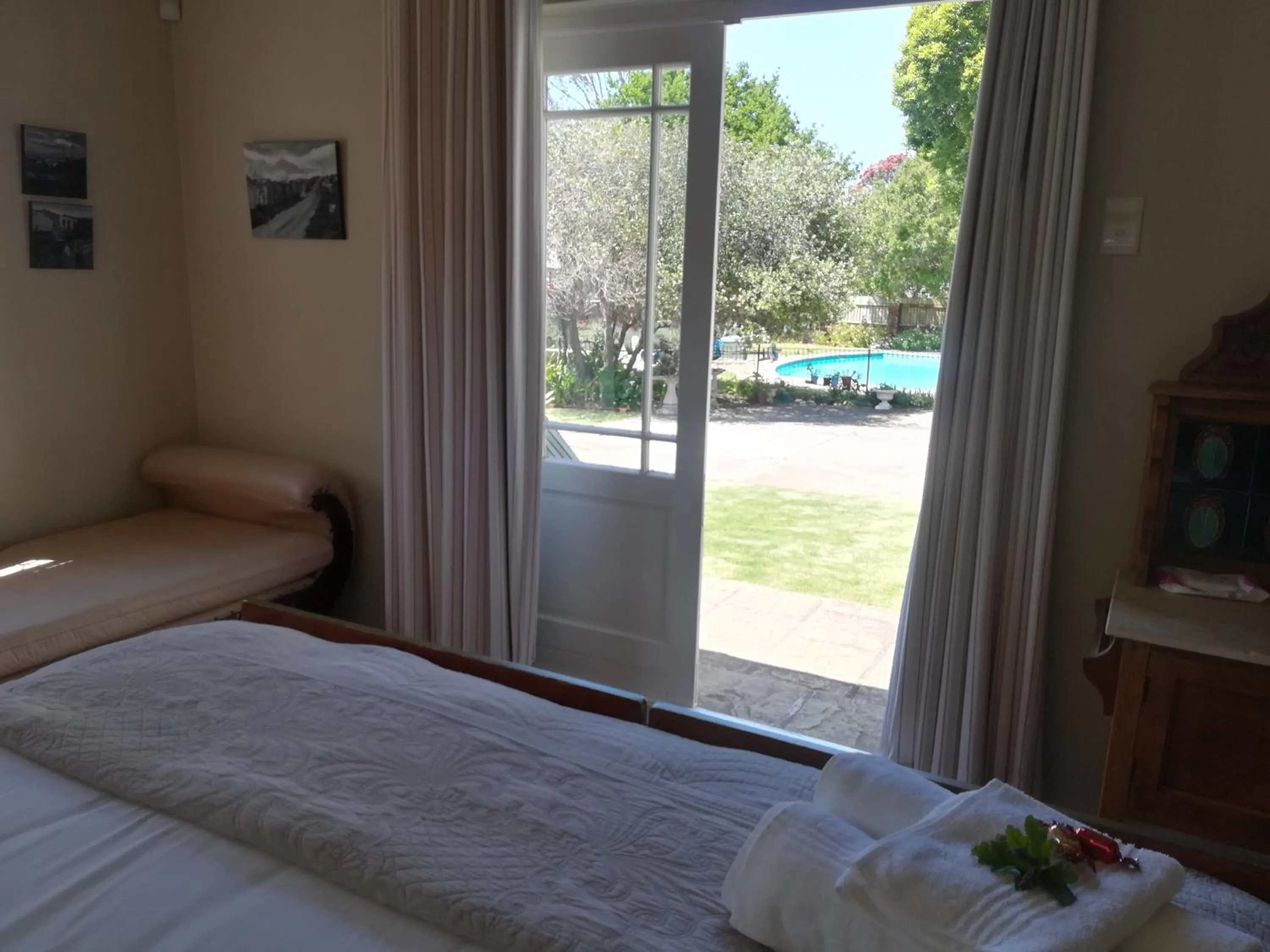 Pool view, Bed in AppleBee Guest Cottages