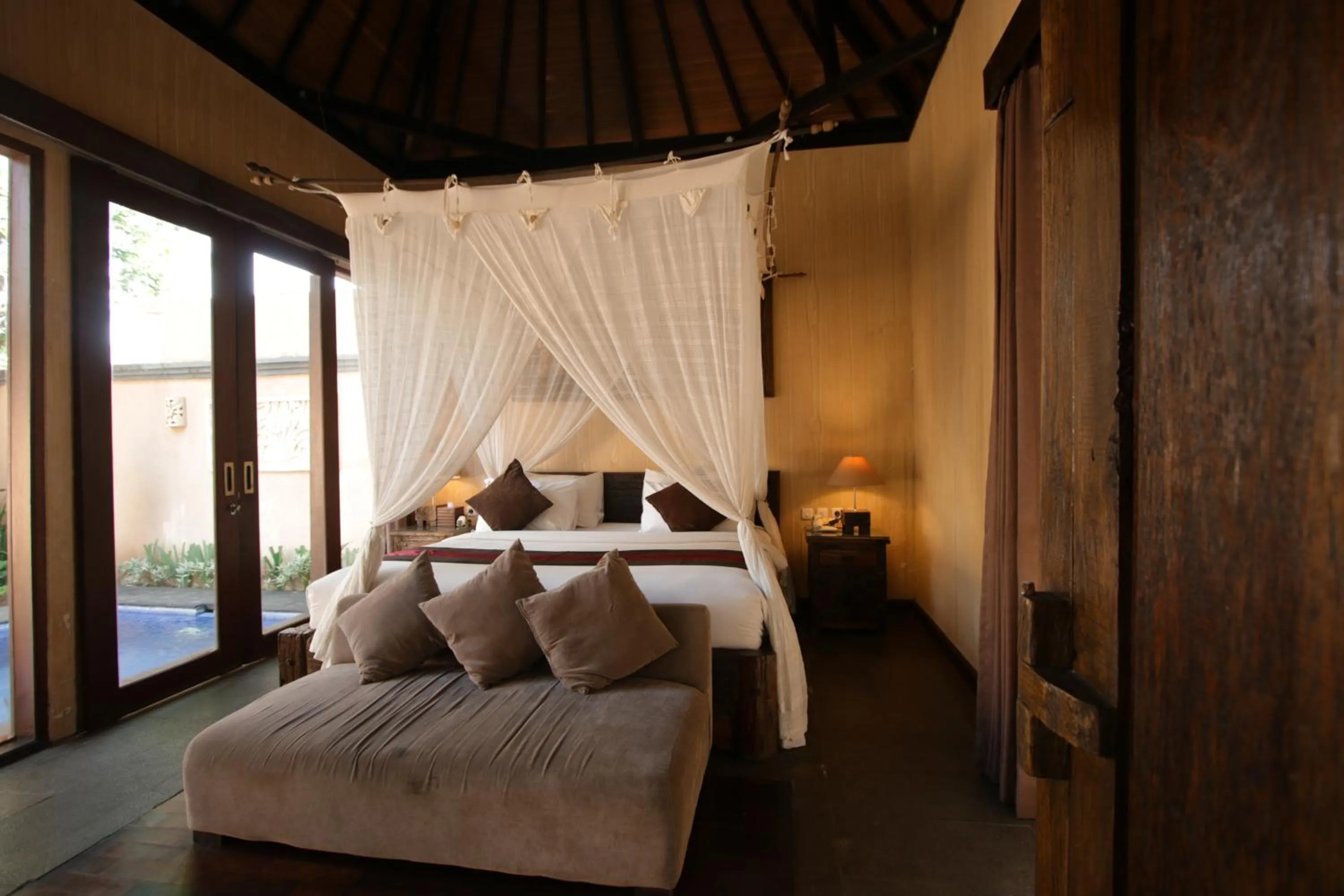 Bed in Gino Feruci Villa Ubud by KAGUM Hotels