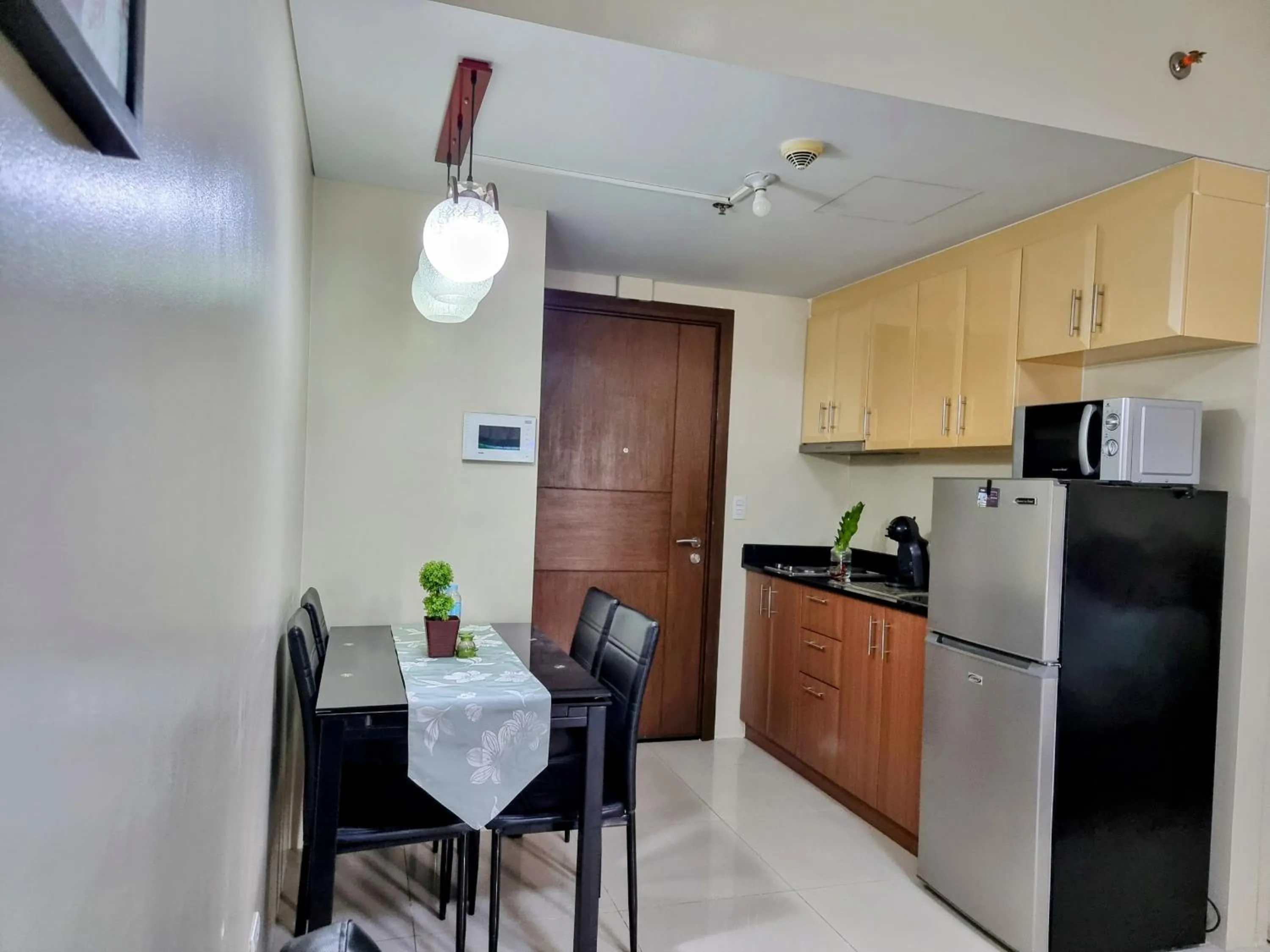 Kitchen or kitchenette in One Palm Tree Villas Condo Across NAIA Terminal 3