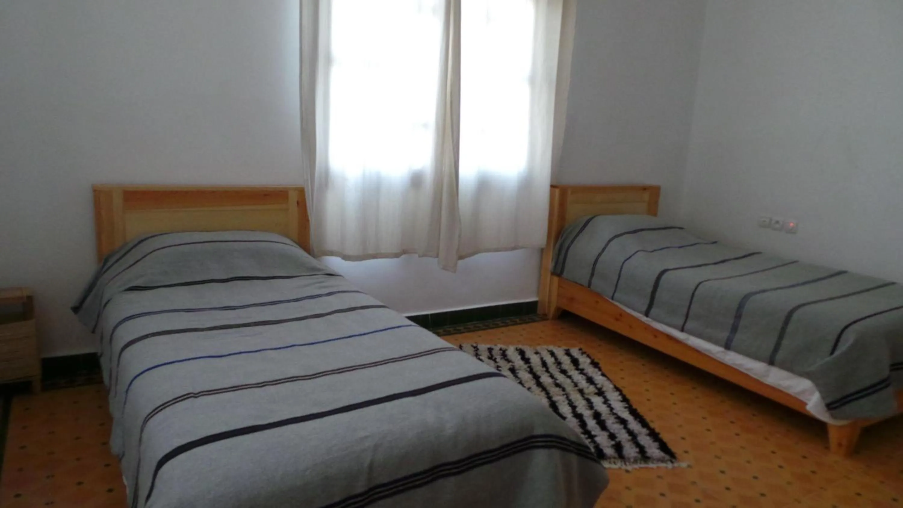 Photo of the whole room, Bed in Targafit Hotel & Hammam