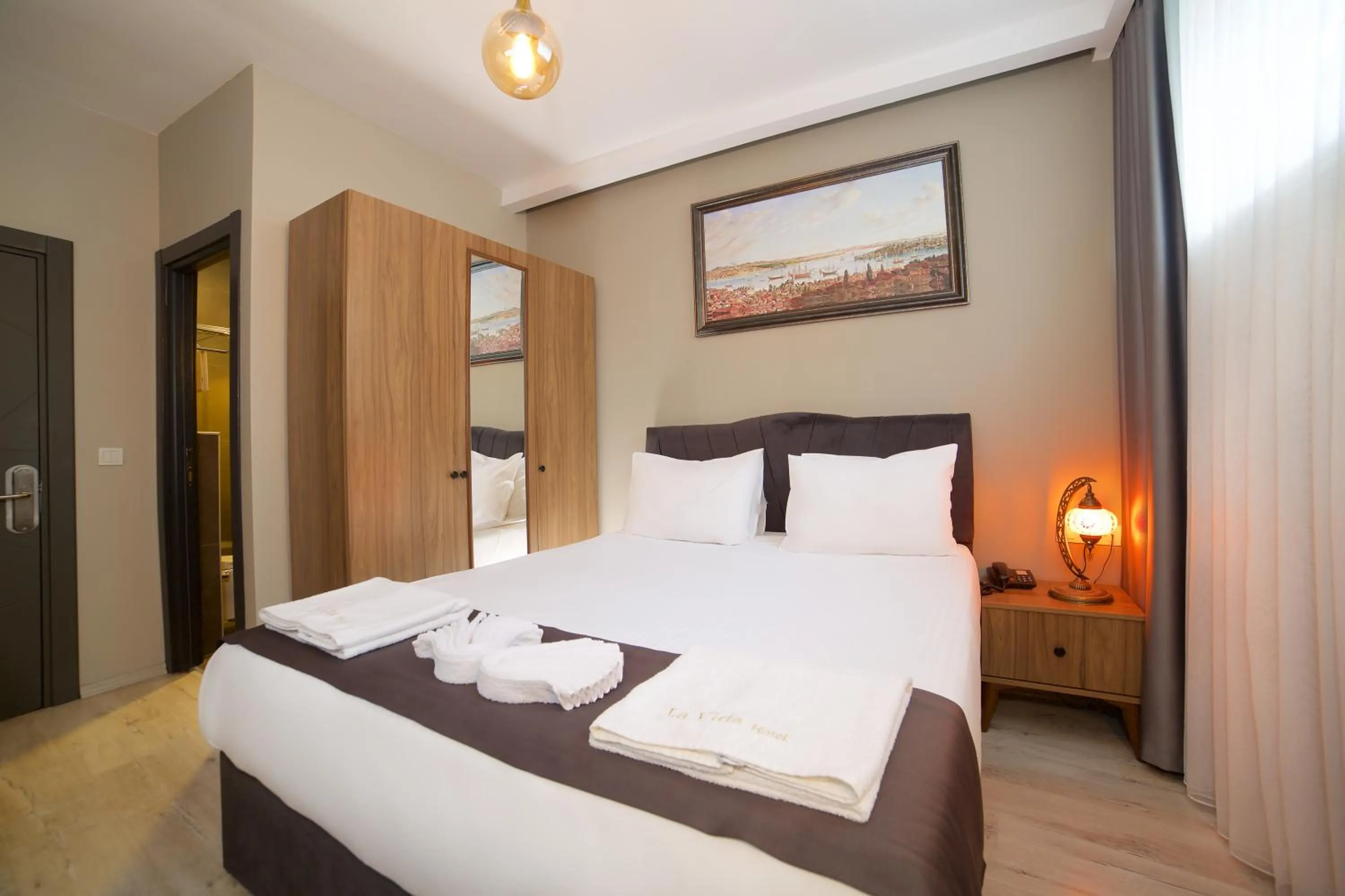 Bed in La Vida Old City Hotel