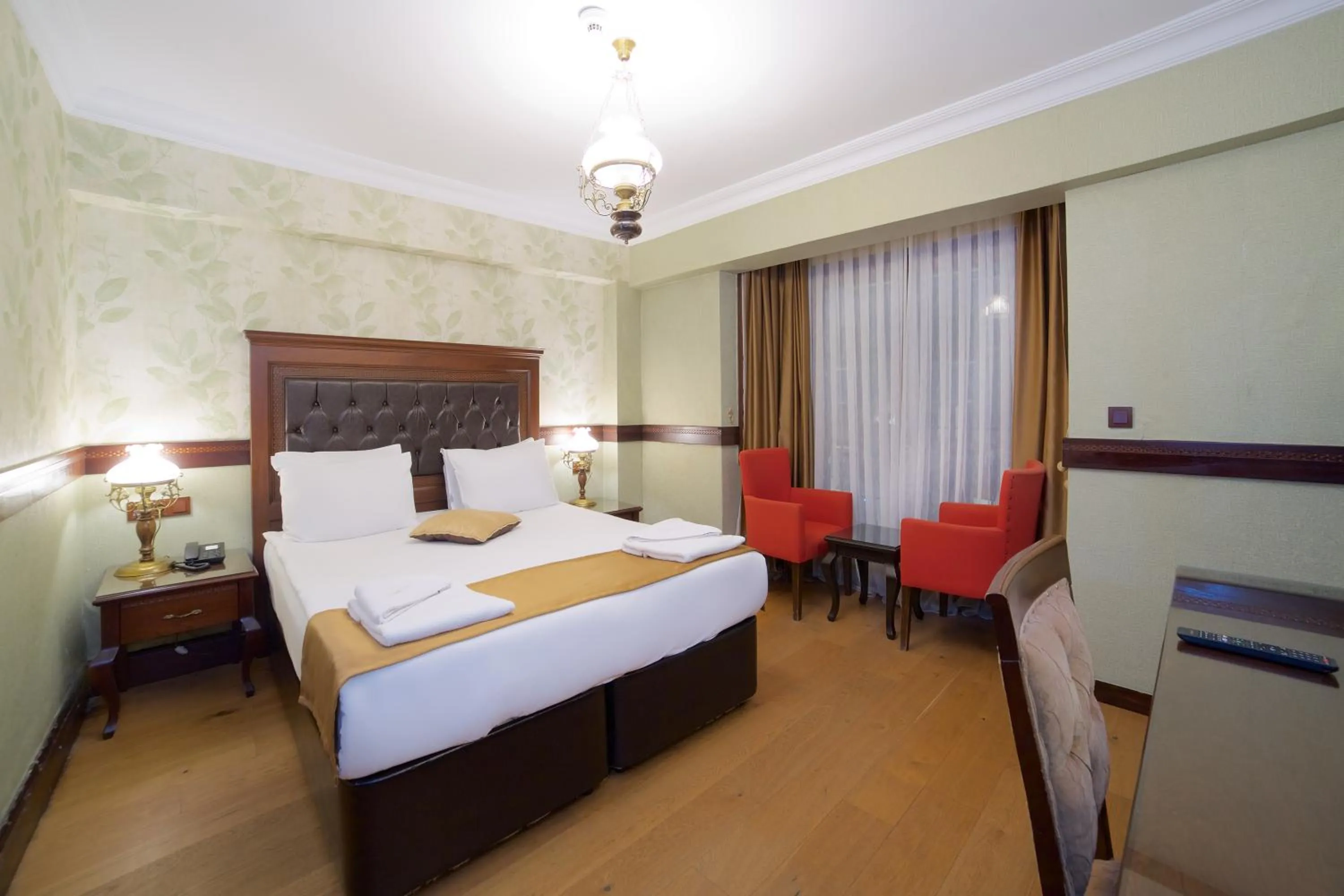 Bed in La Vida Old City Hotel