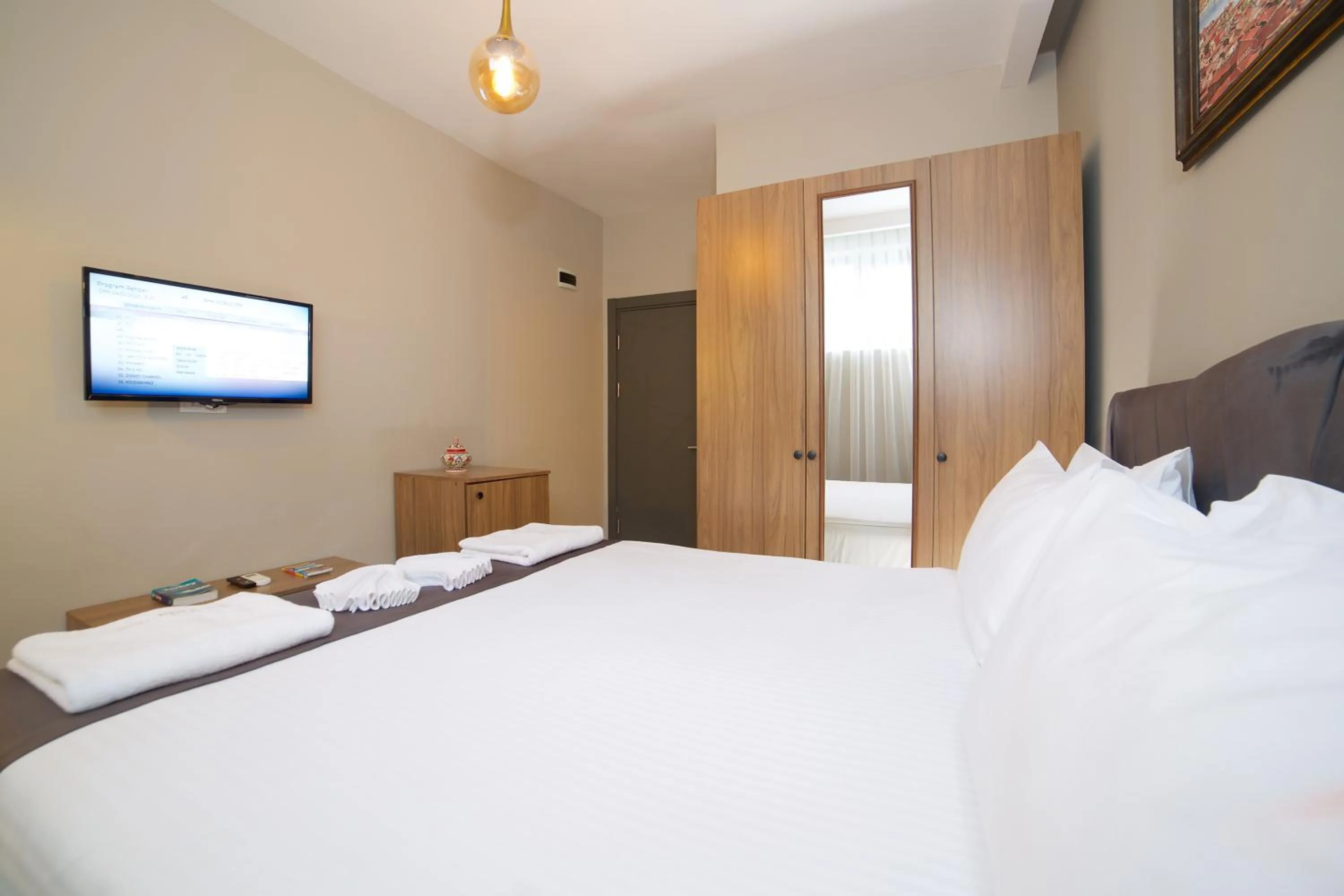 Bed in La Vida Old City Hotel