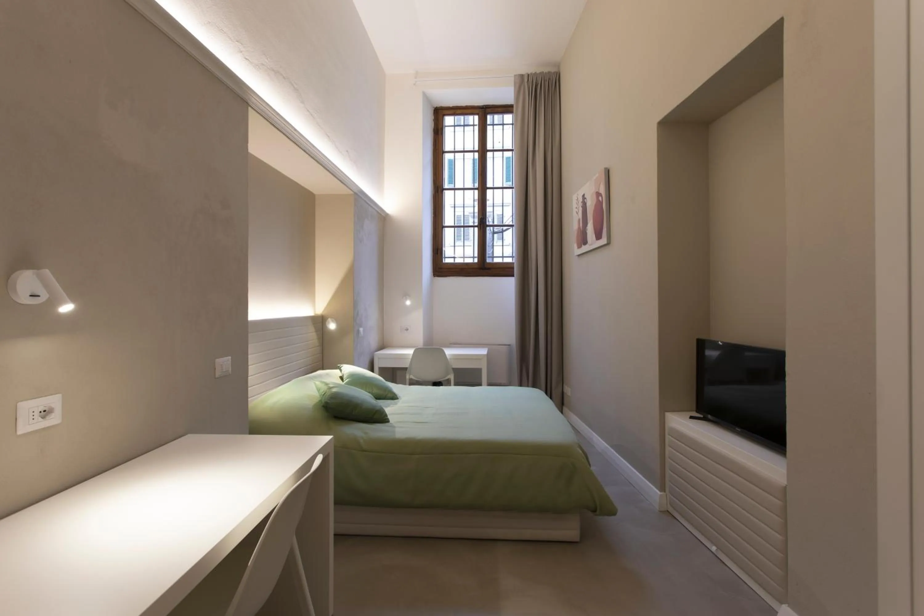 Bed in Palazzo dei Ciompi Suites