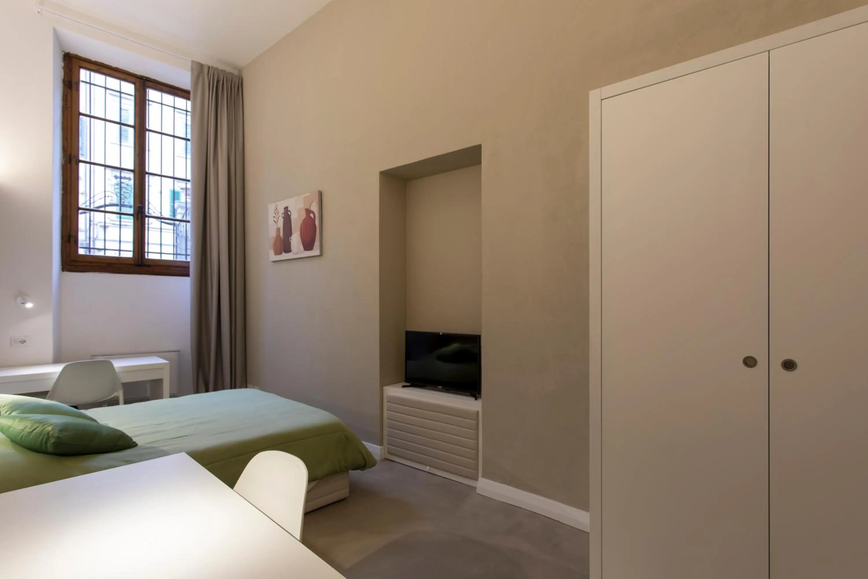 Bed in Palazzo dei Ciompi Suites