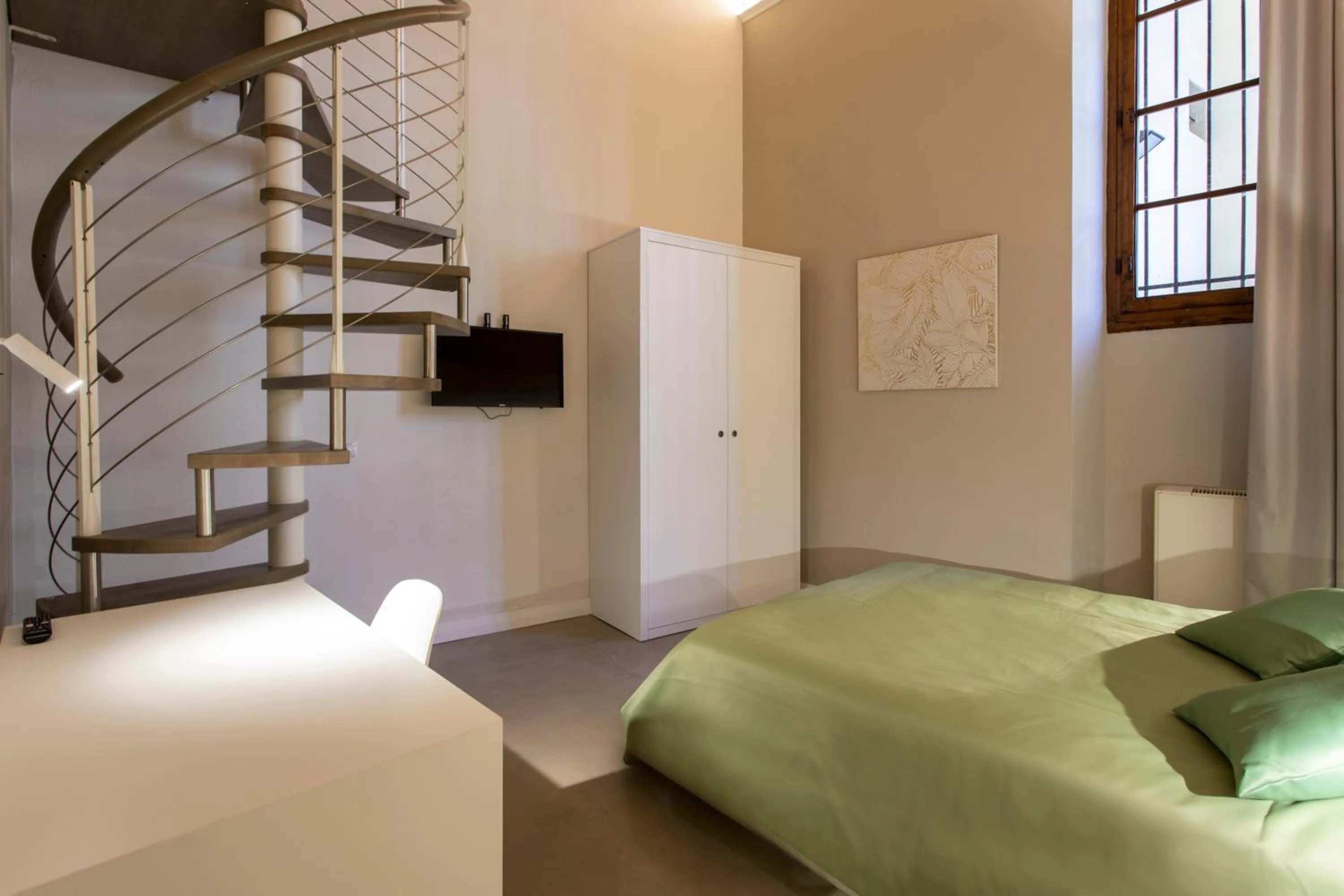 Bed in Palazzo dei Ciompi Suites