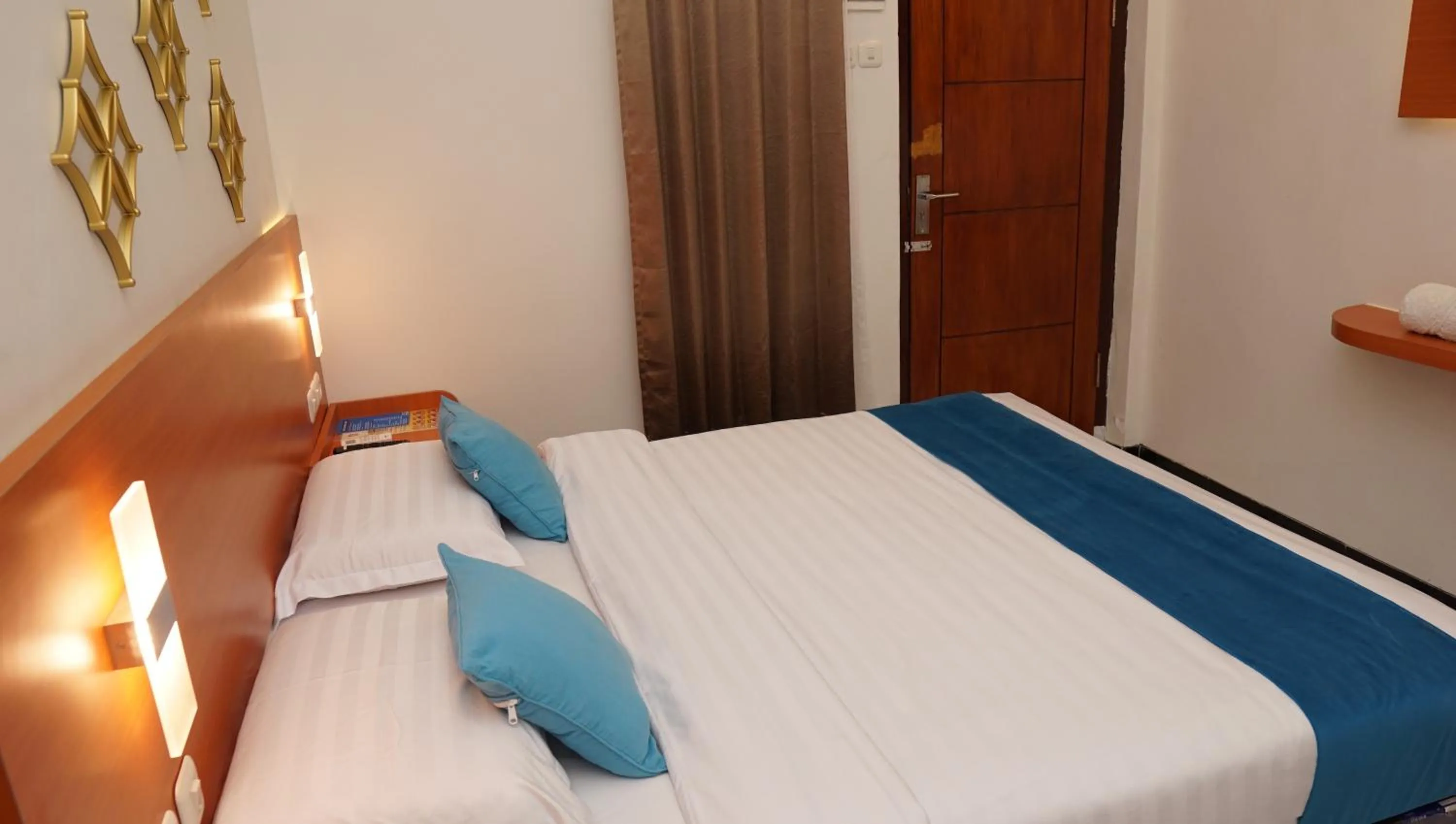 Bed in Jazz Room Kampung Inggris Syariah