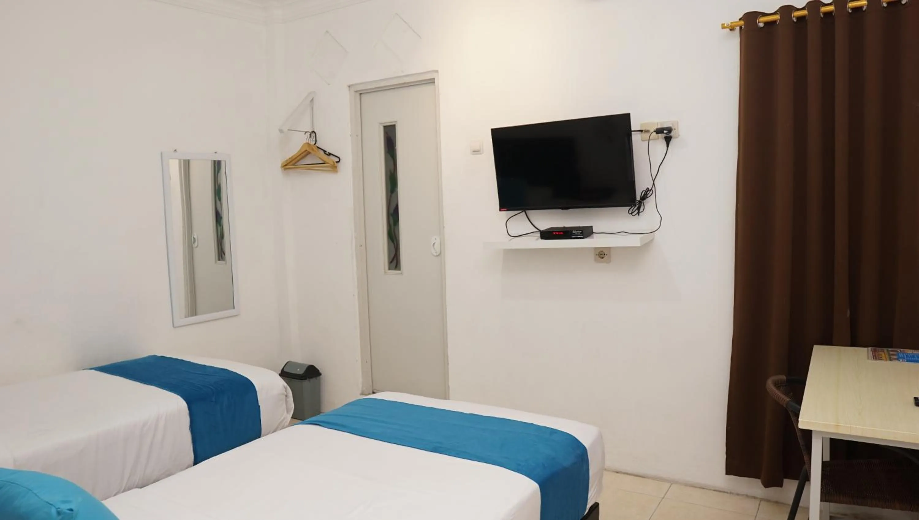 Bed in Jazz Room Kampung Inggris Syariah