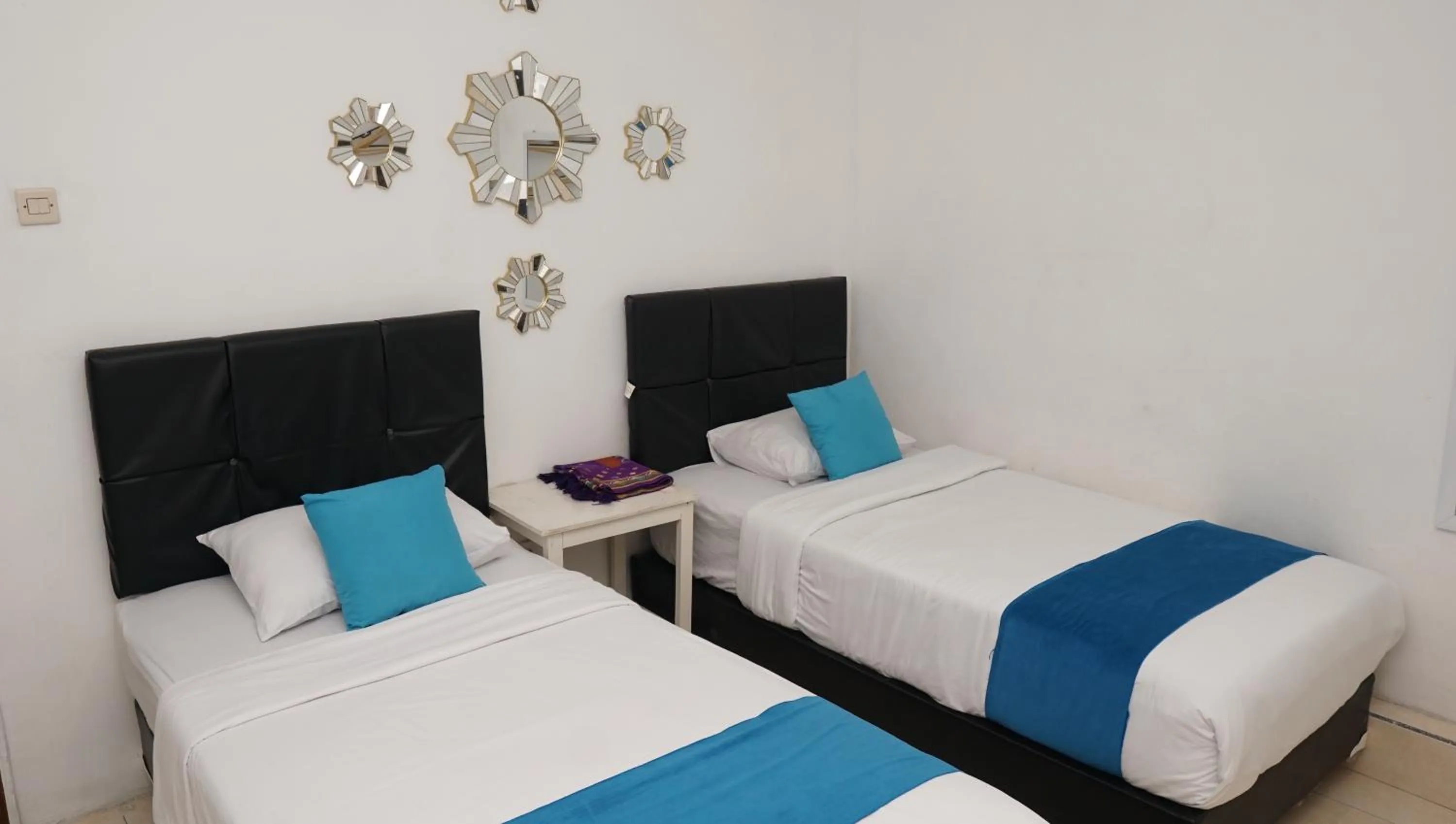 Bed in Jazz Room Kampung Inggris Syariah