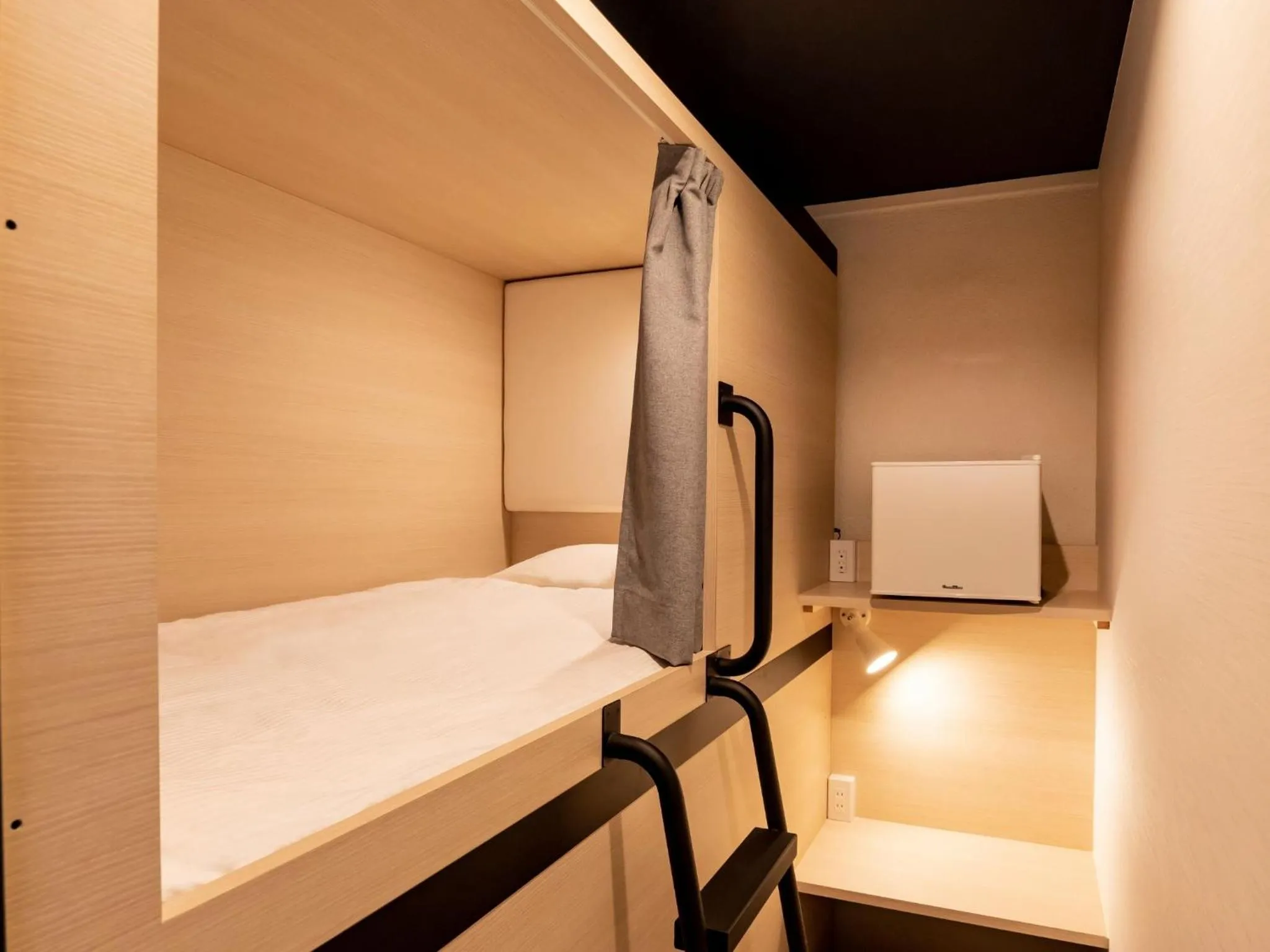 Bed in CABIN&HOTEL CONSTANT NAHA
