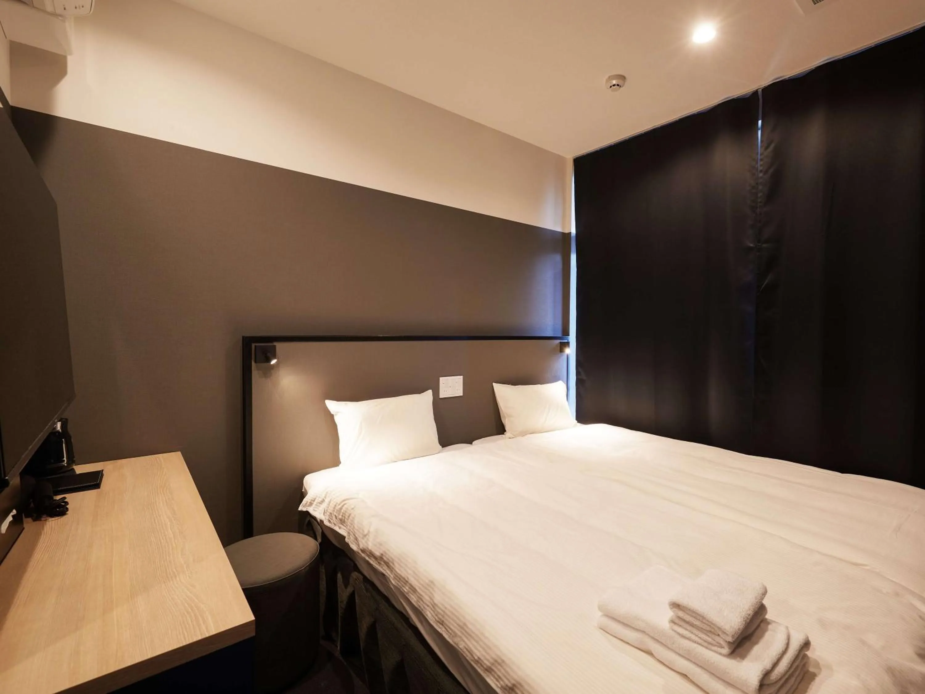 Bed in CABIN&HOTEL CONSTANT NAHA
