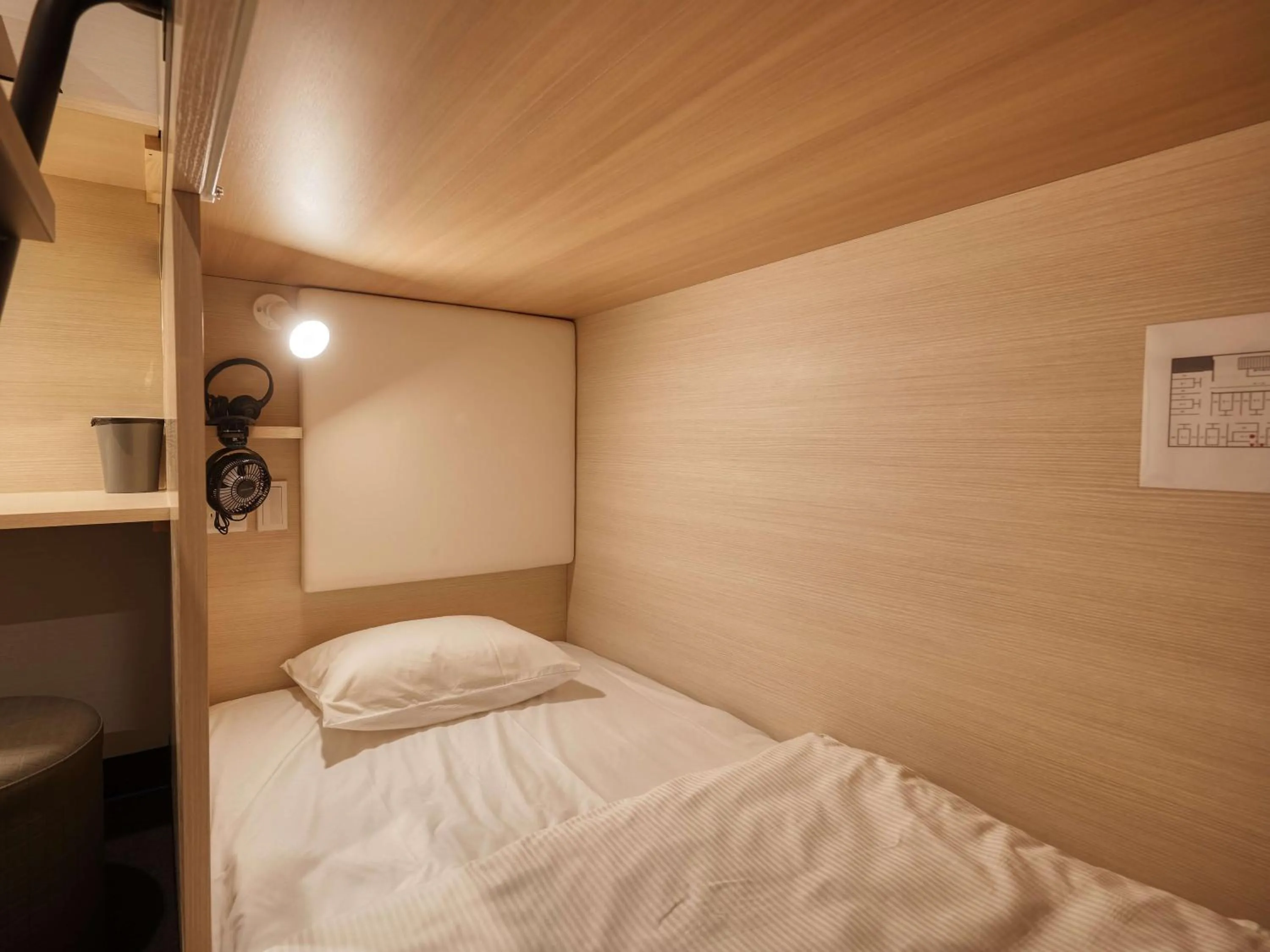 Bed in CABIN&HOTEL CONSTANT NAHA
