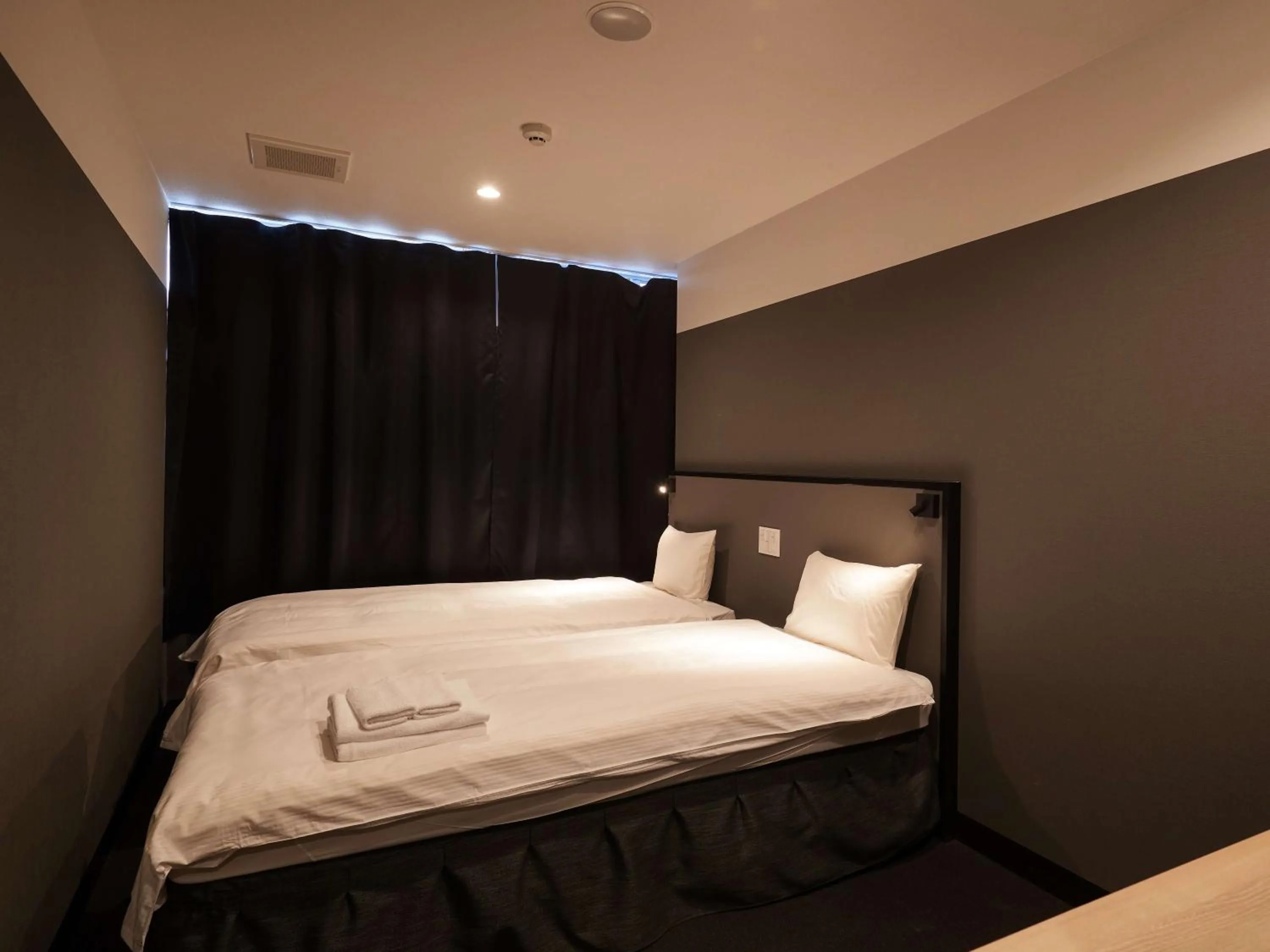 Bed in CABIN&HOTEL CONSTANT NAHA