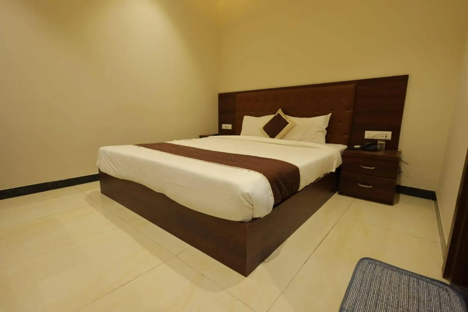 Bed in The Grand Tree Hotel