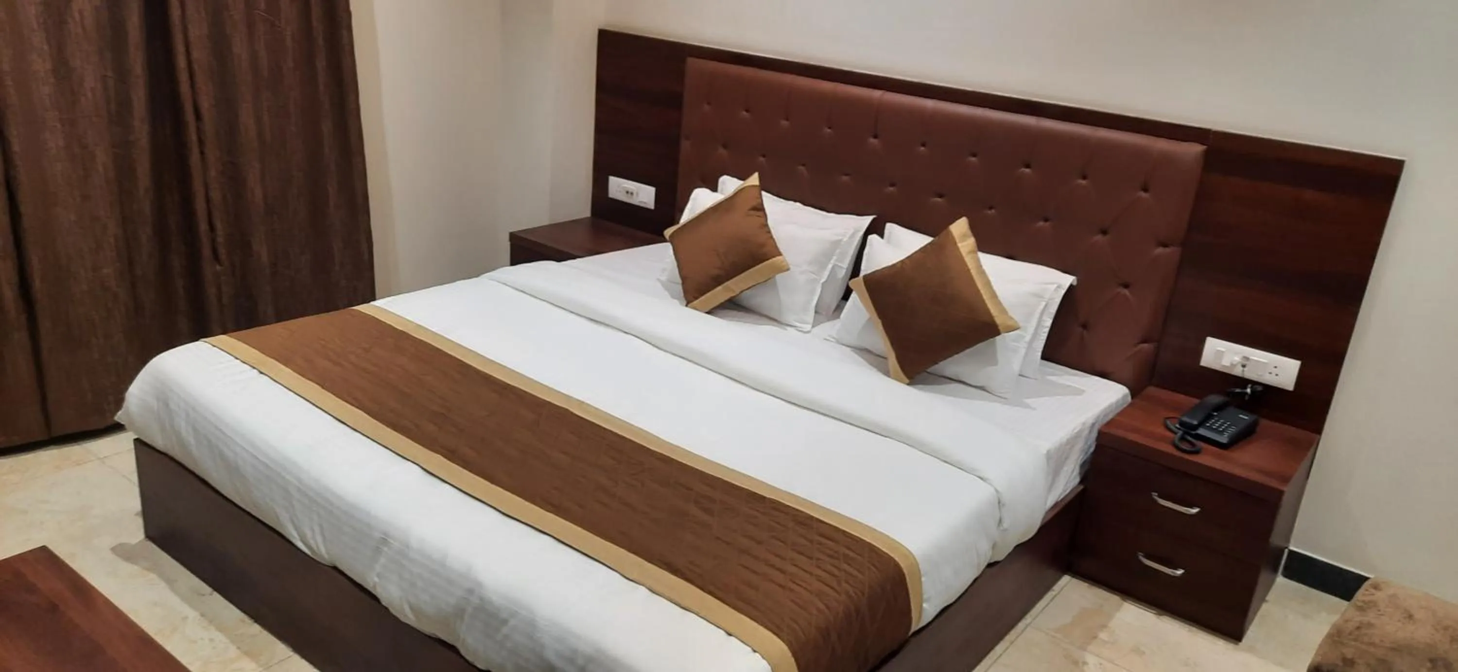 Bed in The Grand Tree Hotel