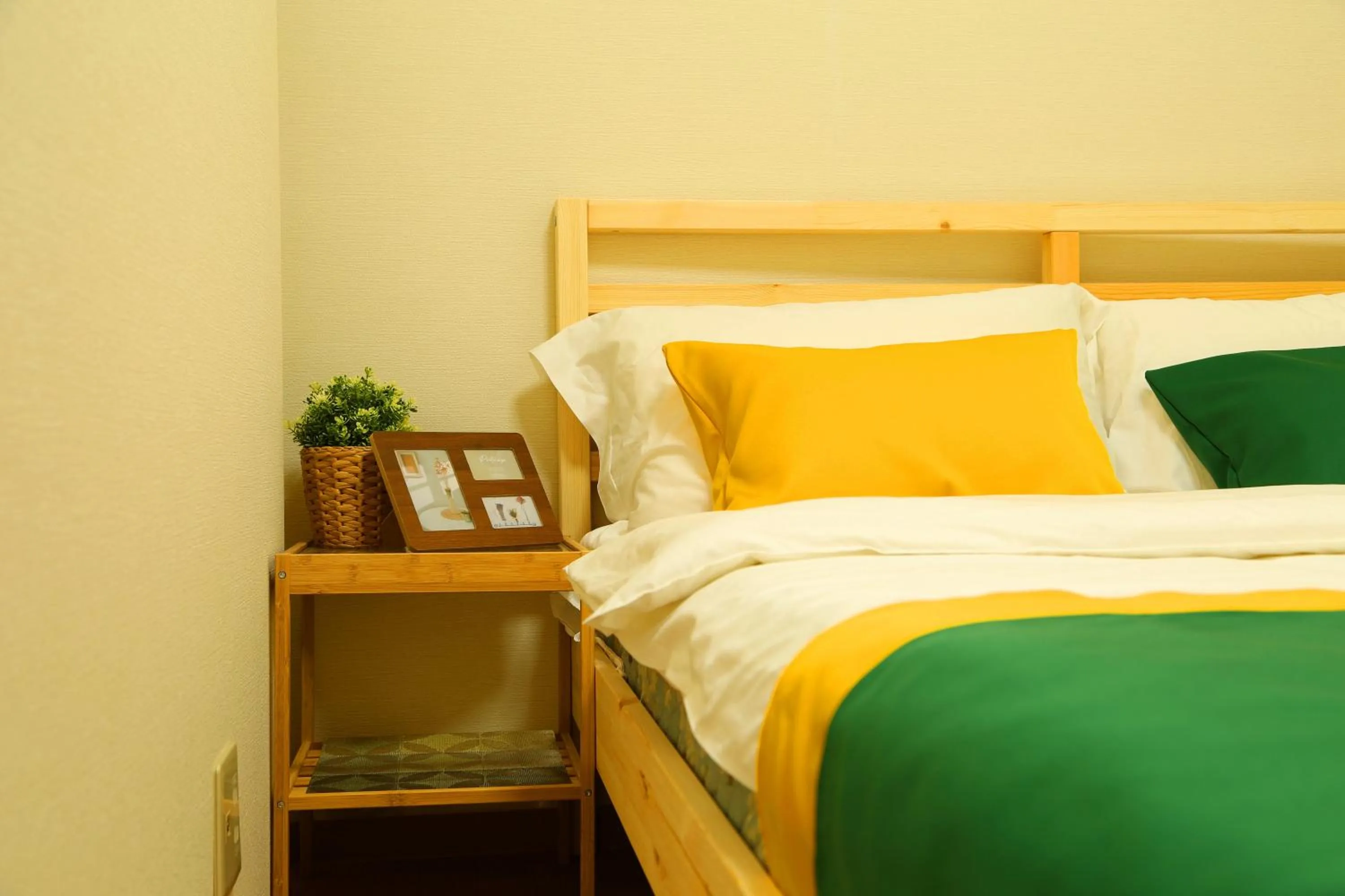 Bed in E JOY INN-West Shinjuku Branch