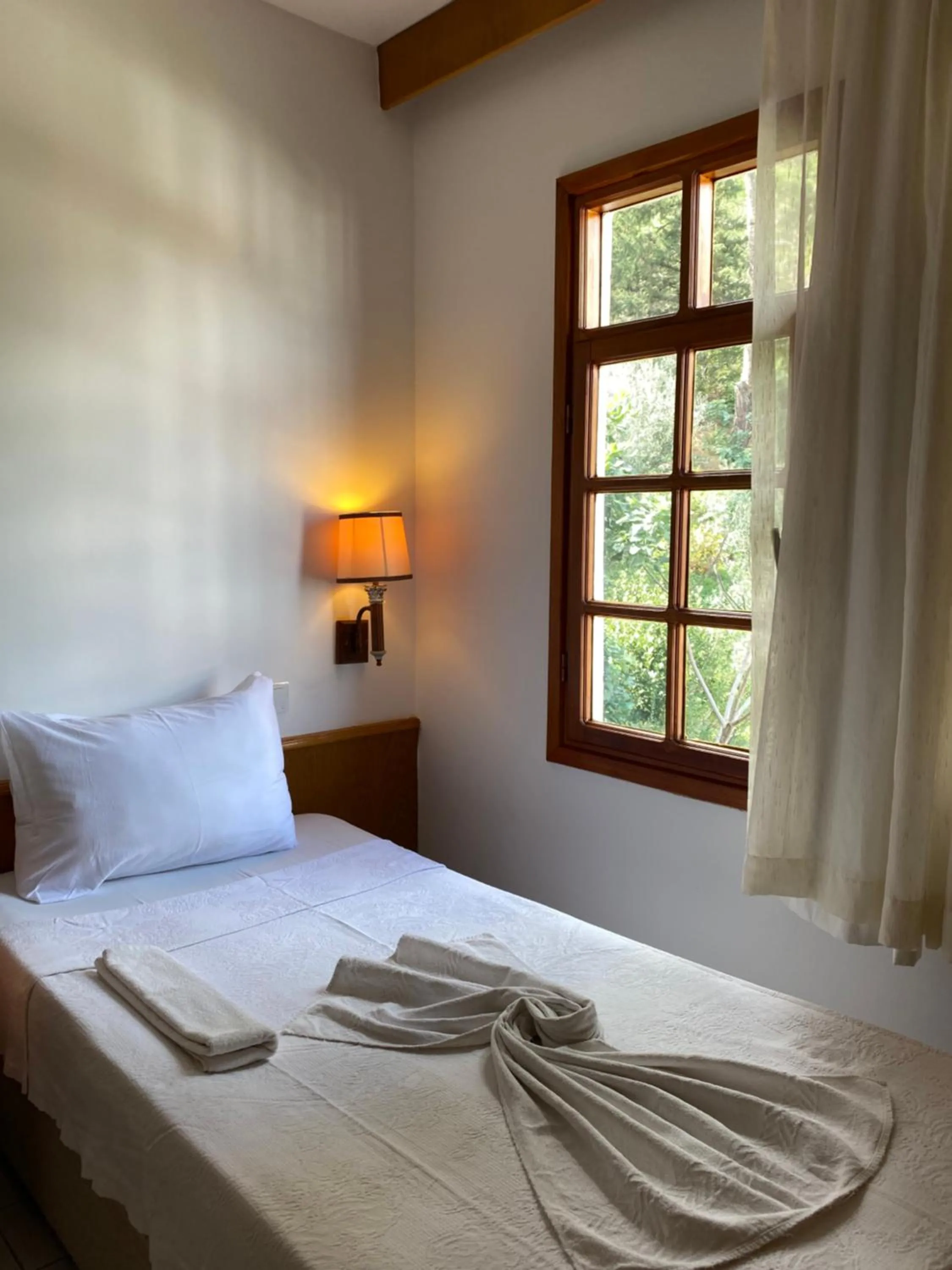 Bed in NATURELLA APART HOTEL