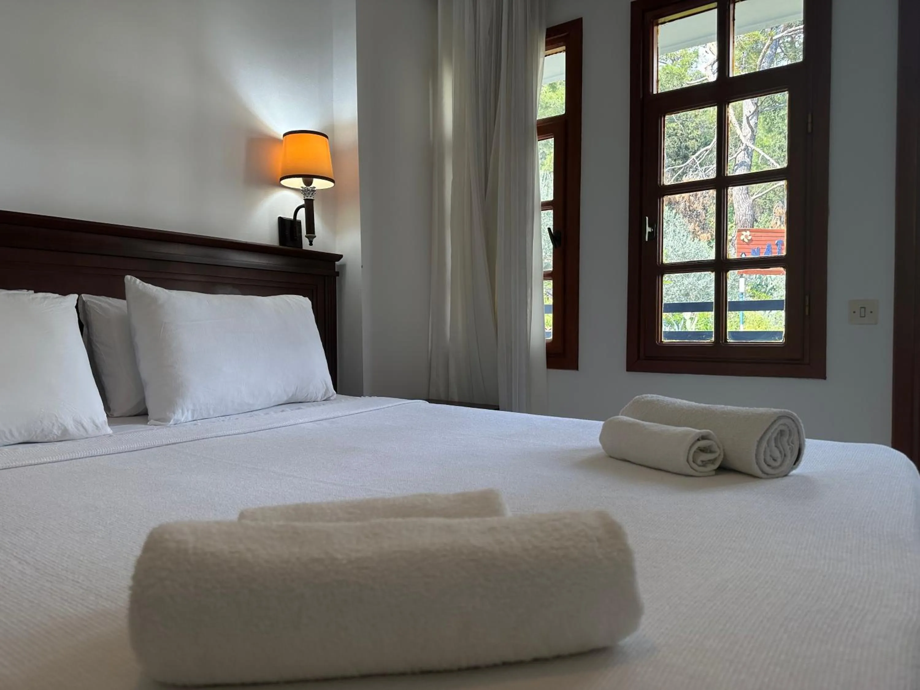 Bed in NATURELLA APART HOTEL