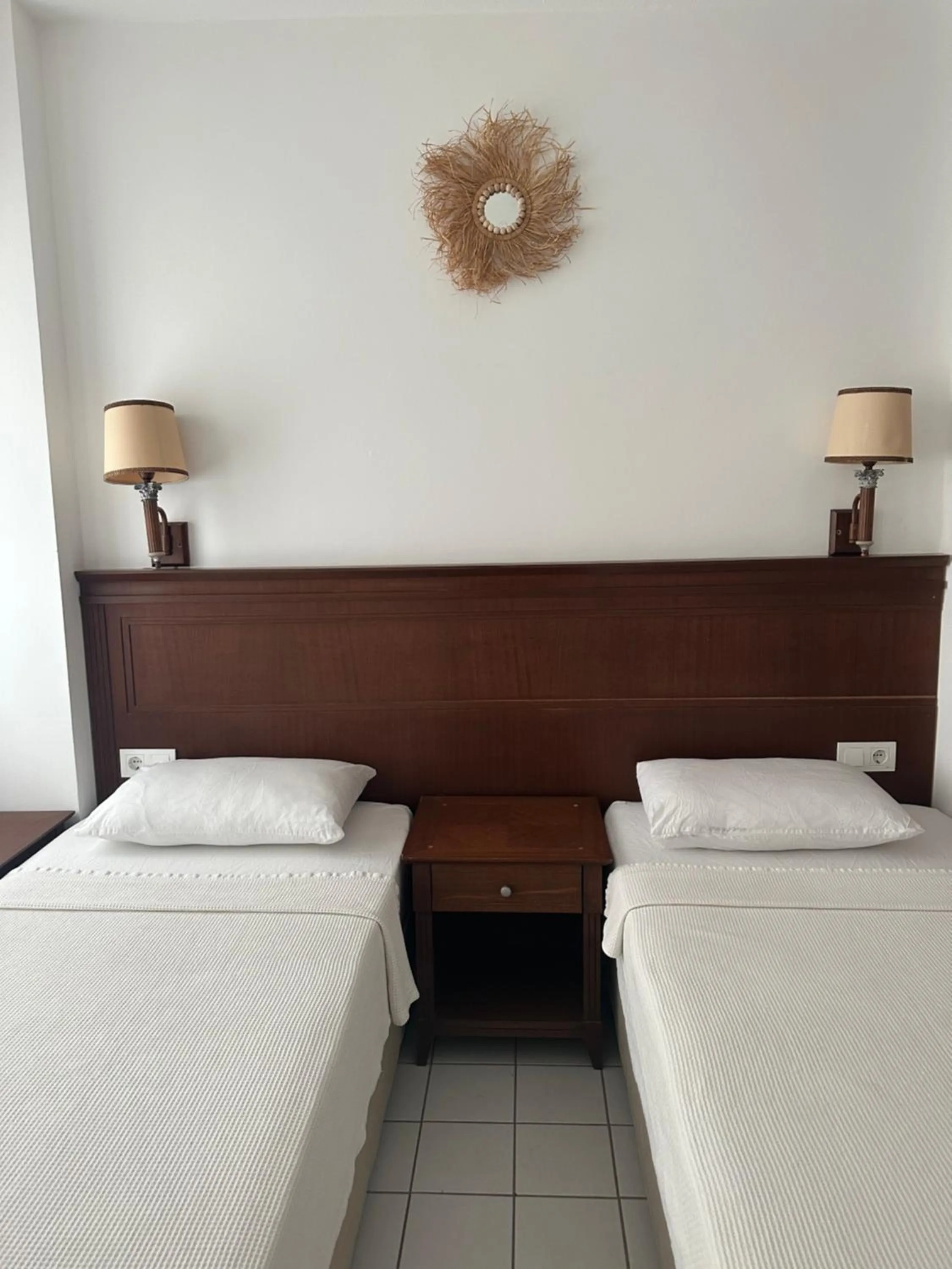 Bed in NATURELLA APART HOTEL