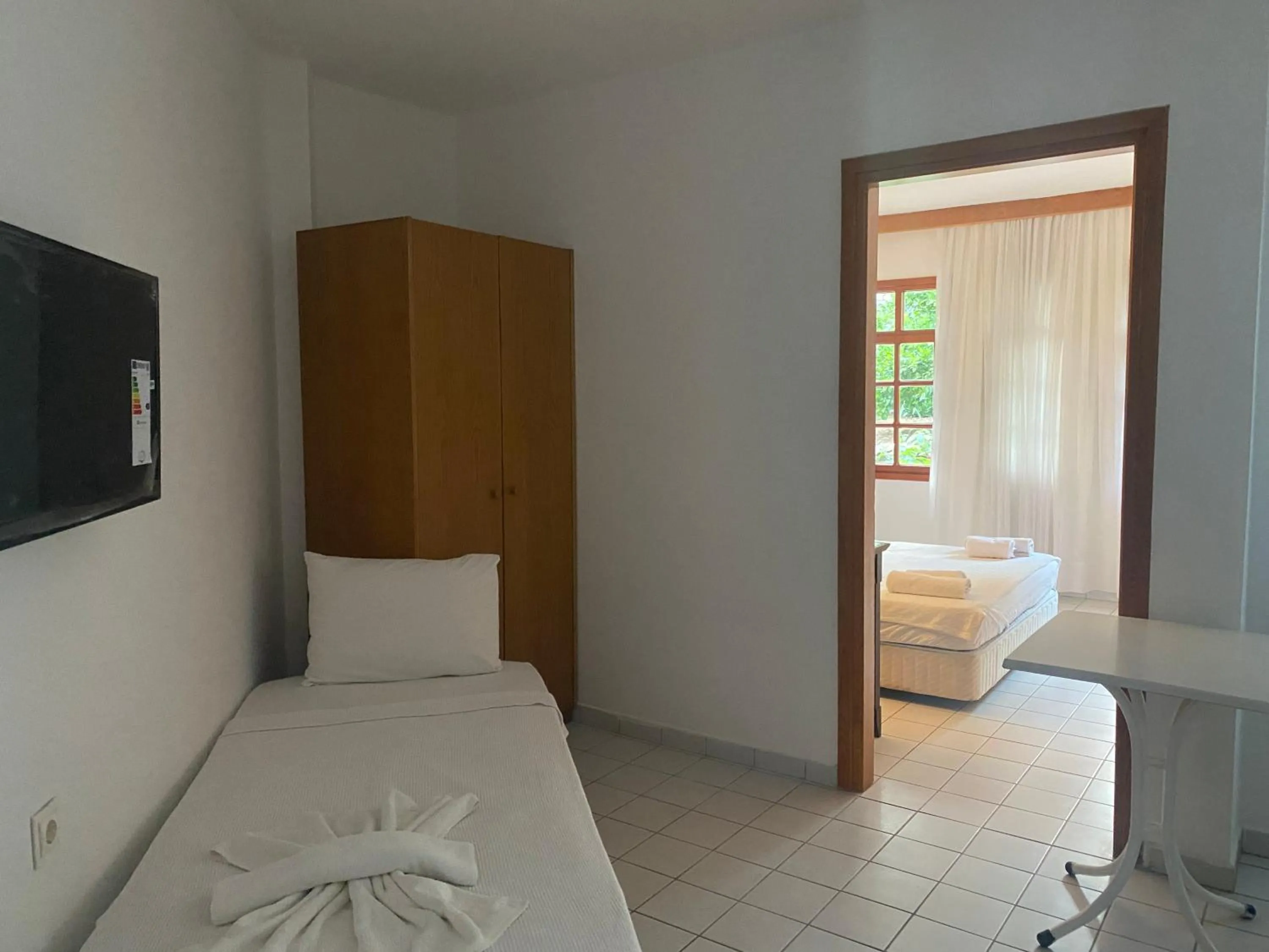 Bed in NATURELLA APART HOTEL