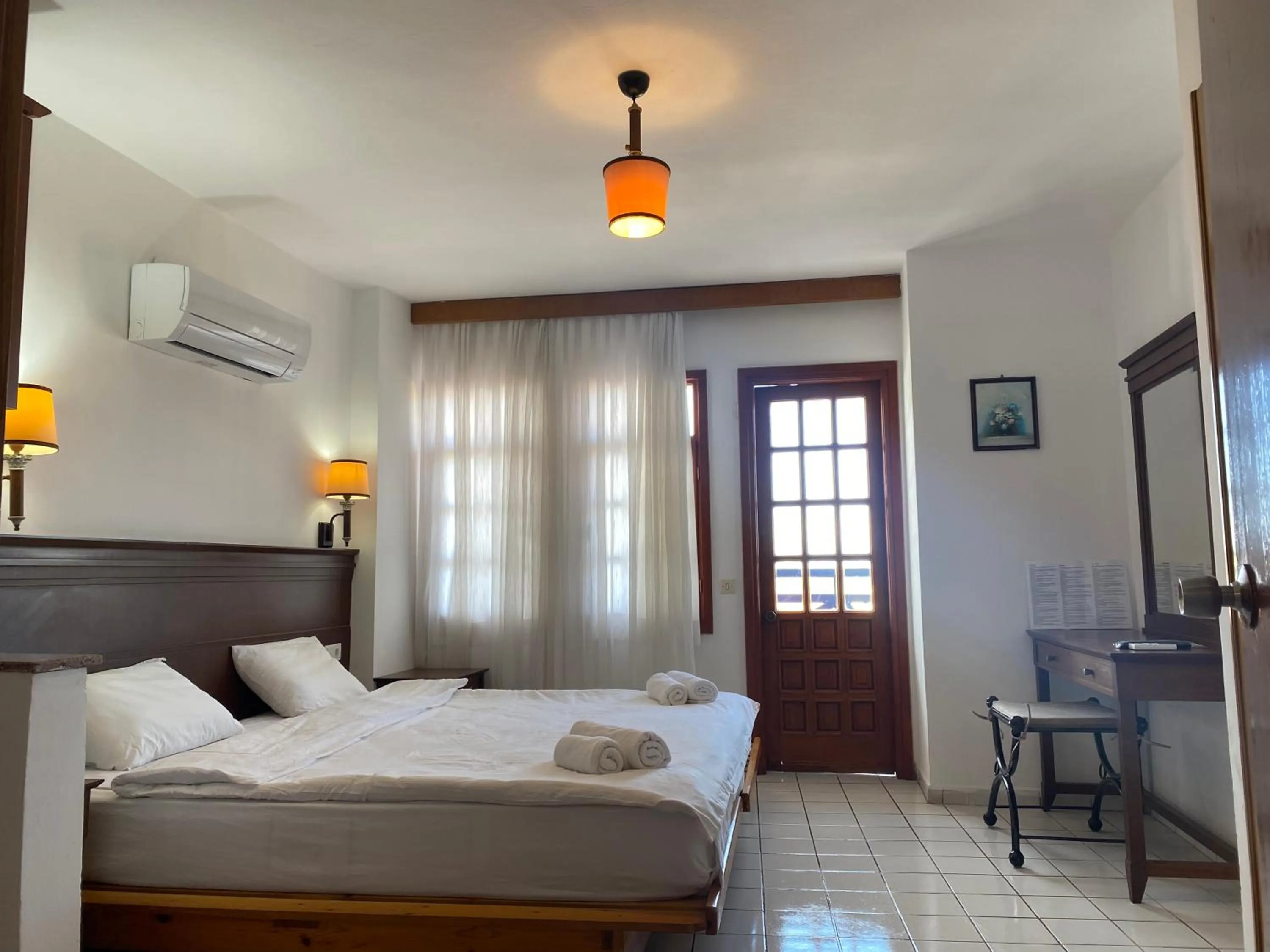 Bed in NATURELLA APART HOTEL