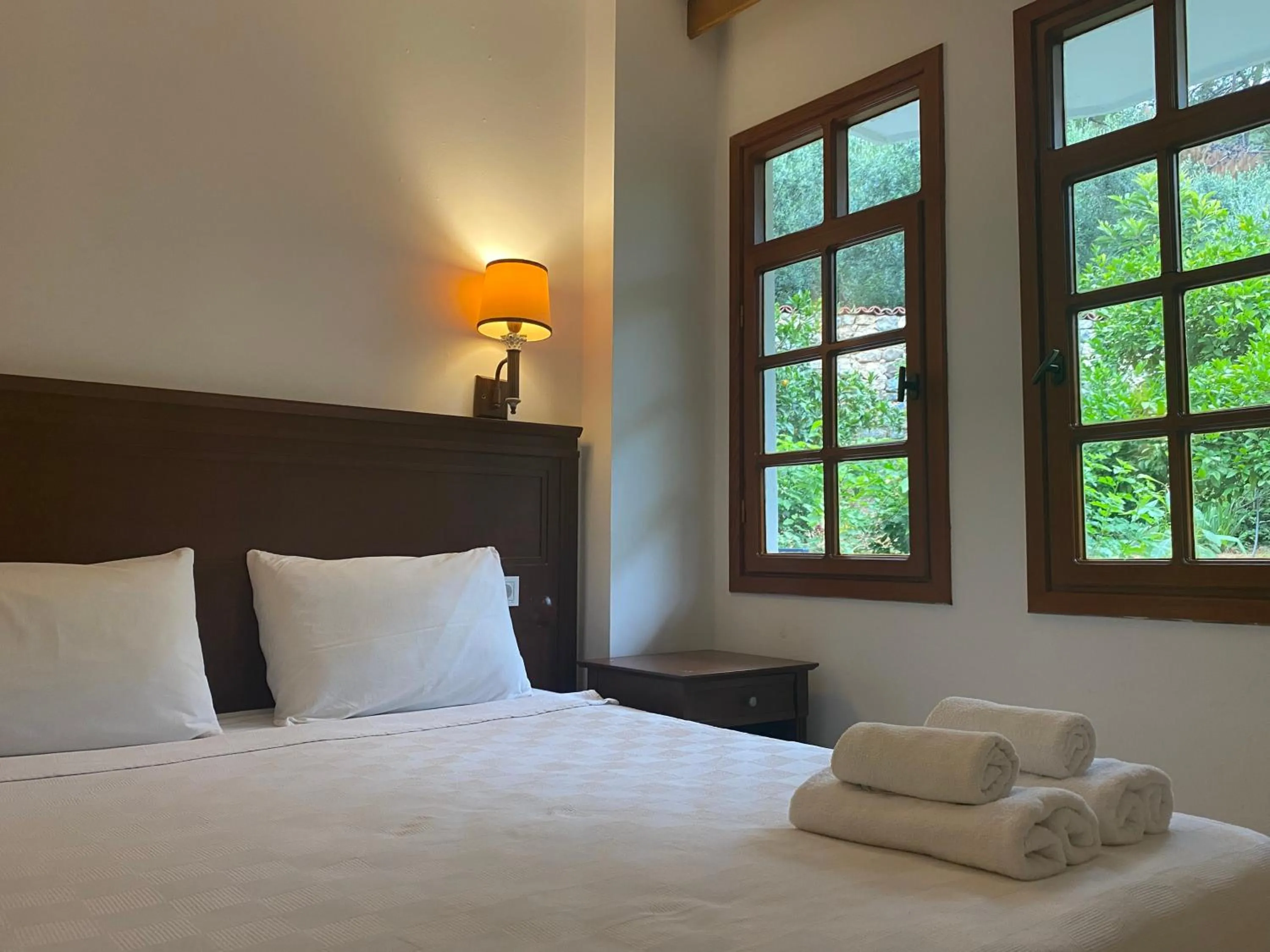 Bed in NATURELLA APART HOTEL