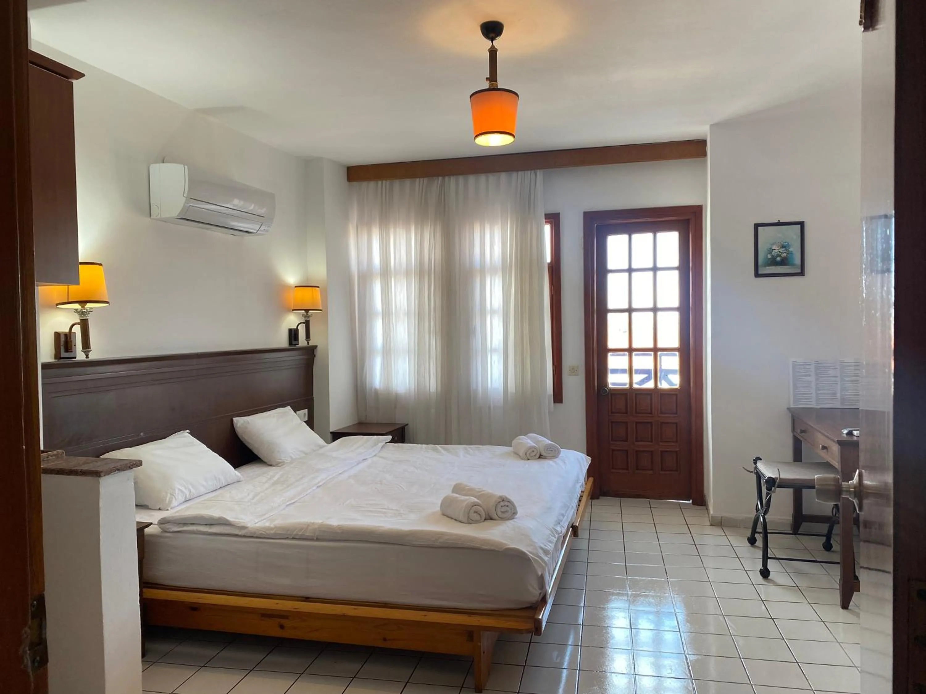 Bed in NATURELLA APART HOTEL